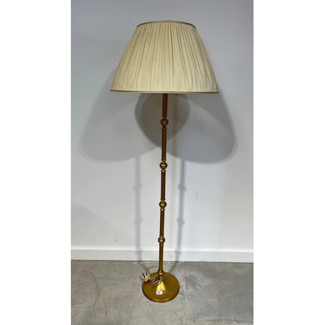 Gold painted standard floor lamp with shade.