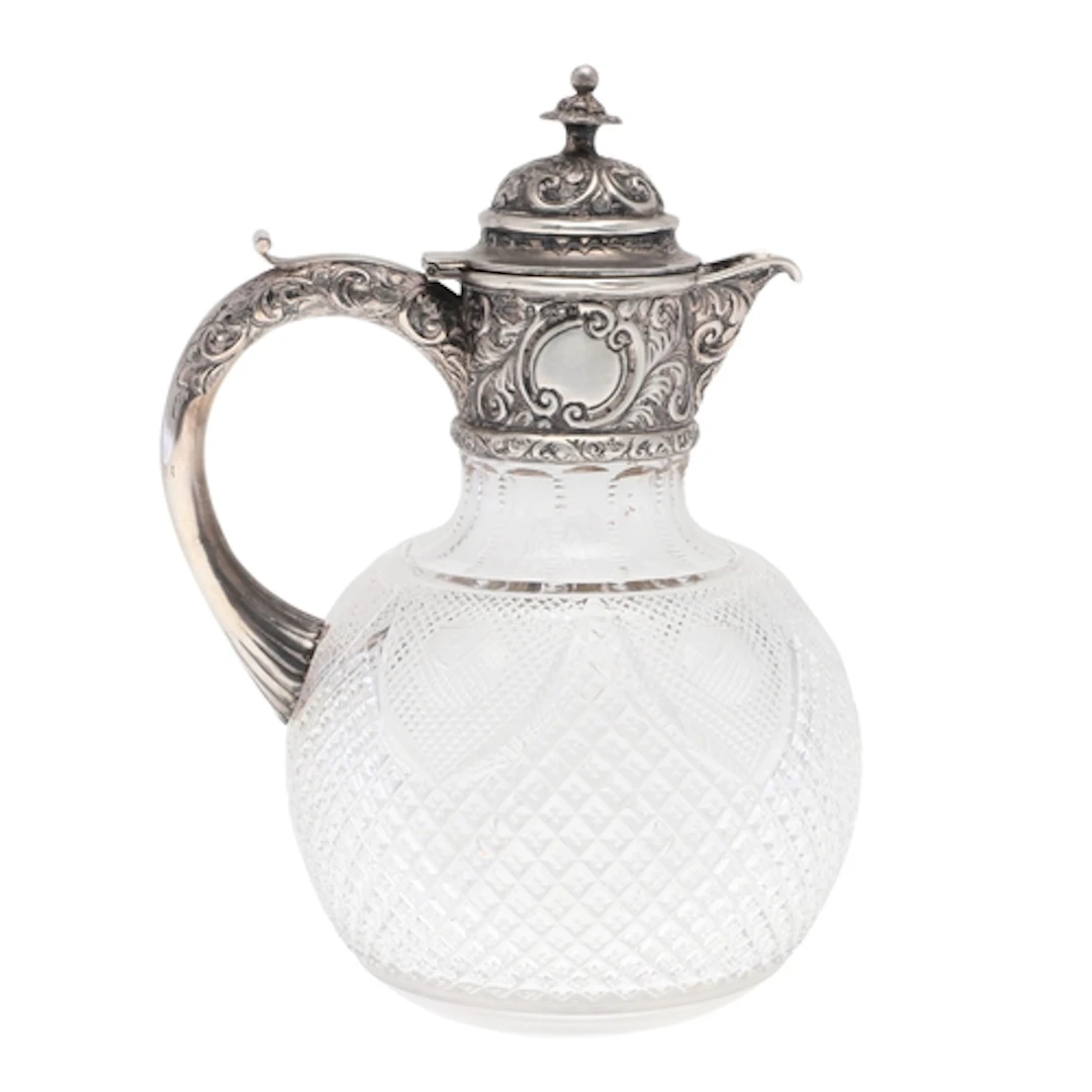 AN EARLY 20TH CENTURY SILVER MOUNTED CUT GLASS CLARET JUG. O...