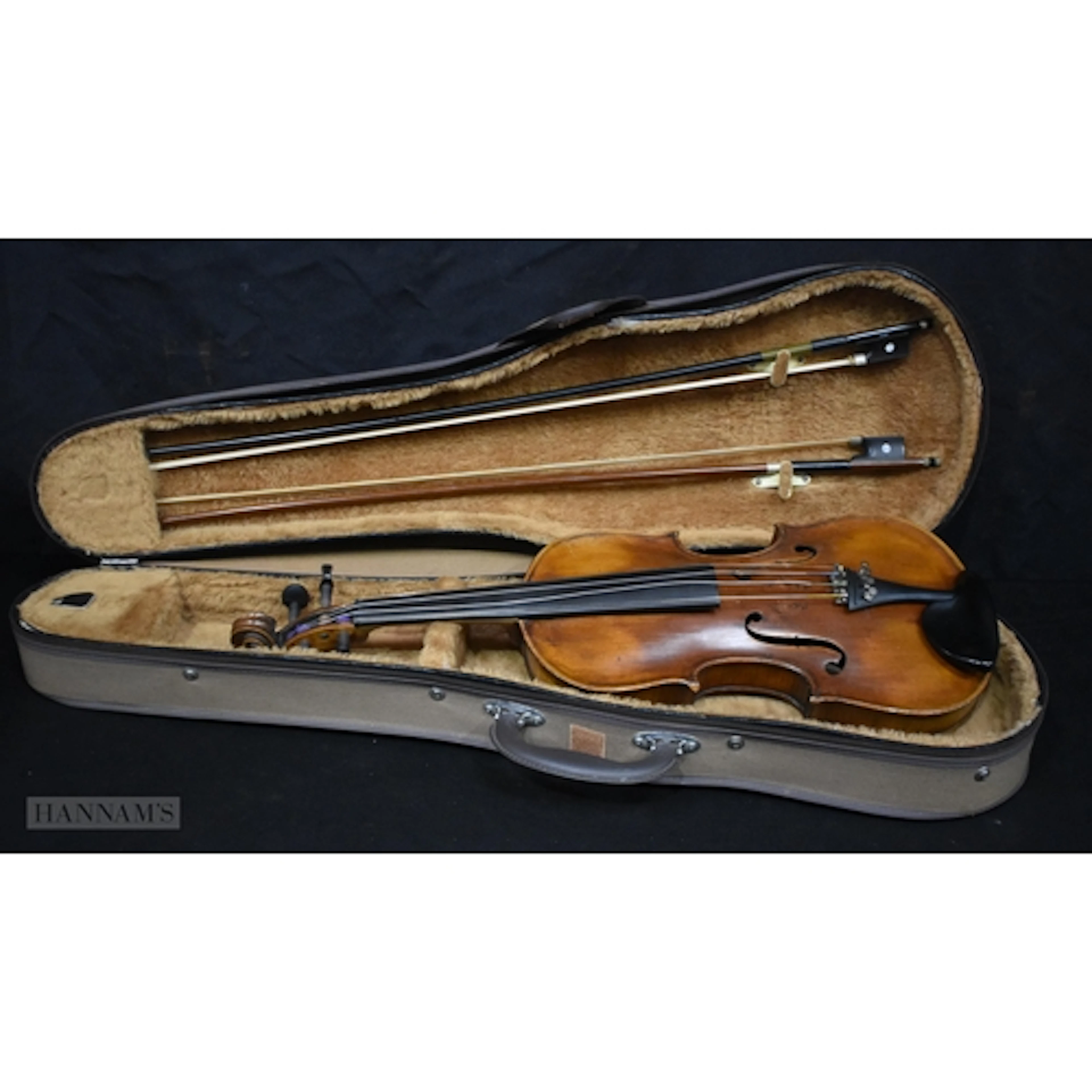 An antique two piece back Violin with 2 bows .