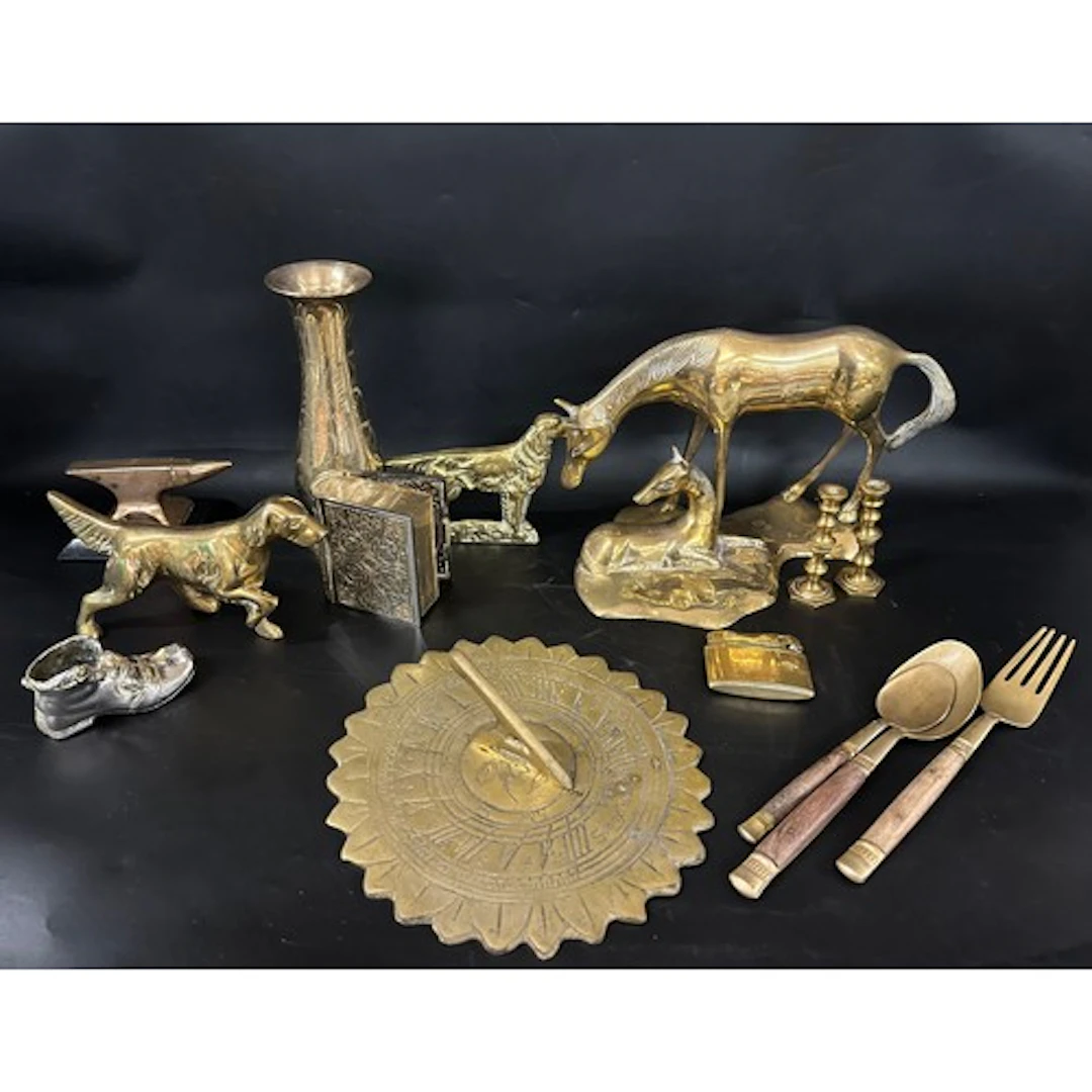 A collection of brass and other metal including a sundial an...