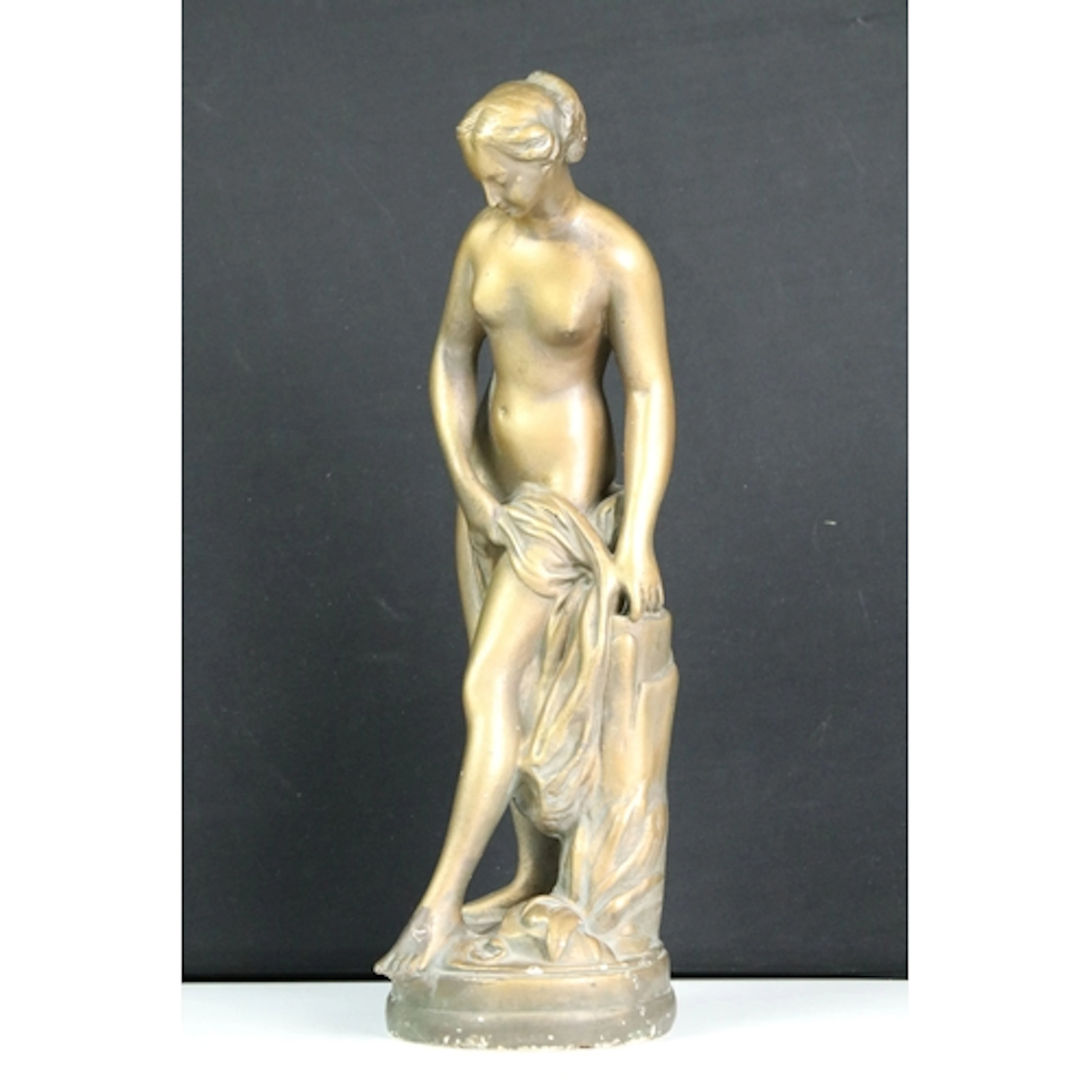 20th century gilt plaster sculpture of a female nude with dr...