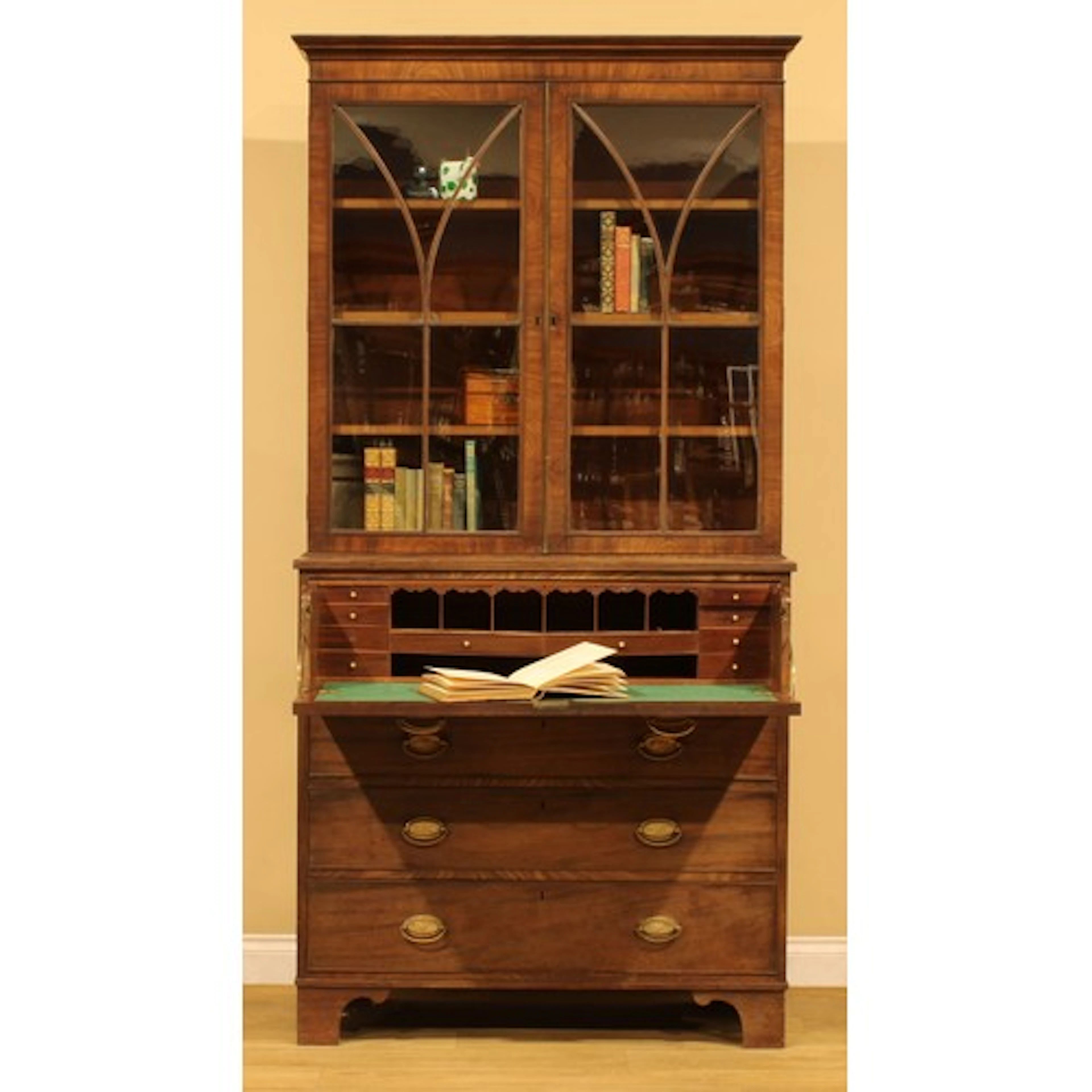 A Regency period mahogany secretaire bookcase, moulded corni...