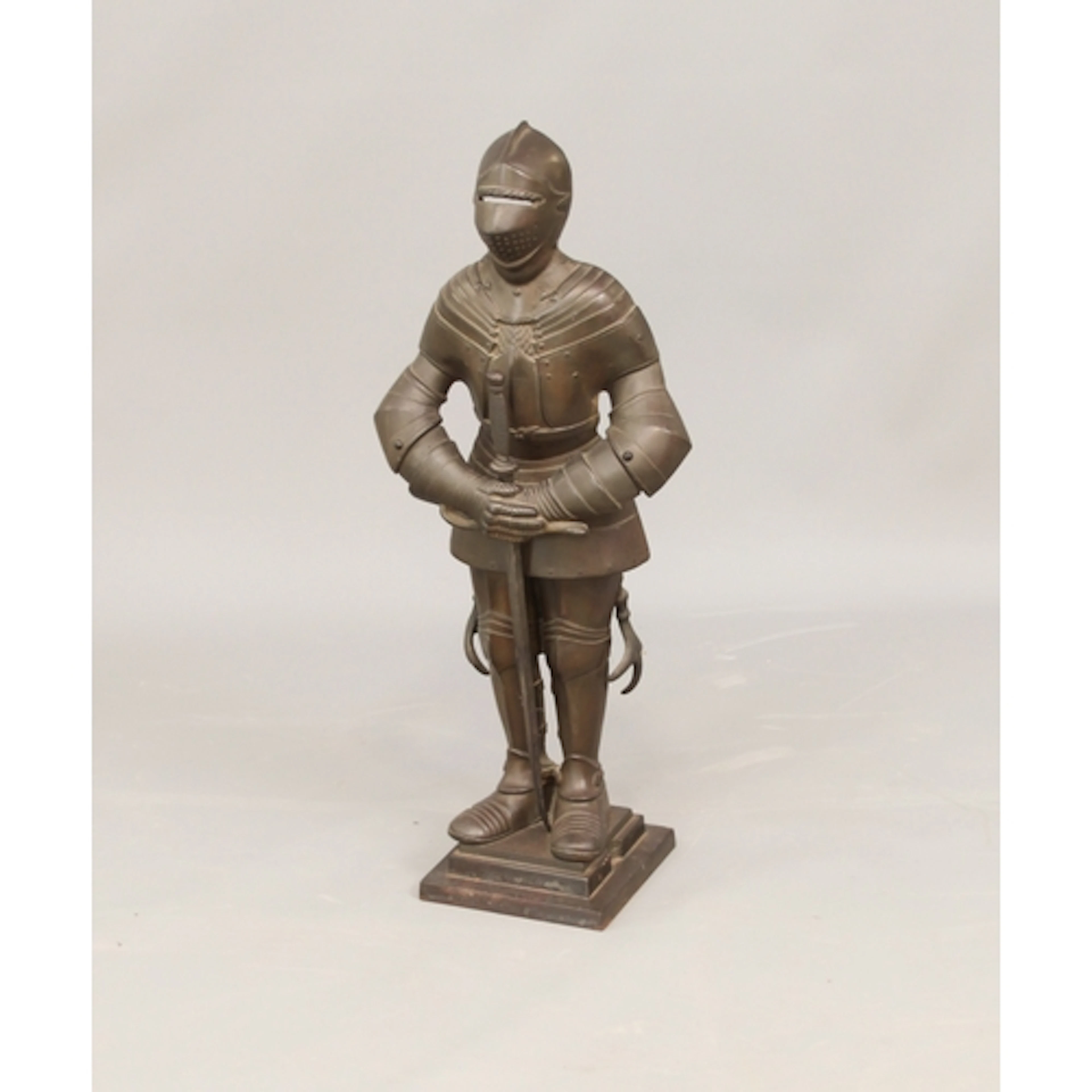 A bronzed cast metal knight-in-armour fireside companion set...