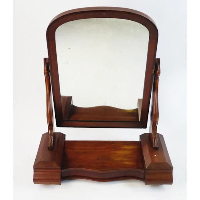 A Victorian mahogany toilet mirror, with arched mirror plate...