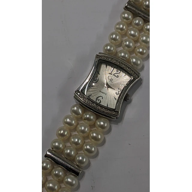 A CR ladies silver wrist watch, having an engine turned dial...