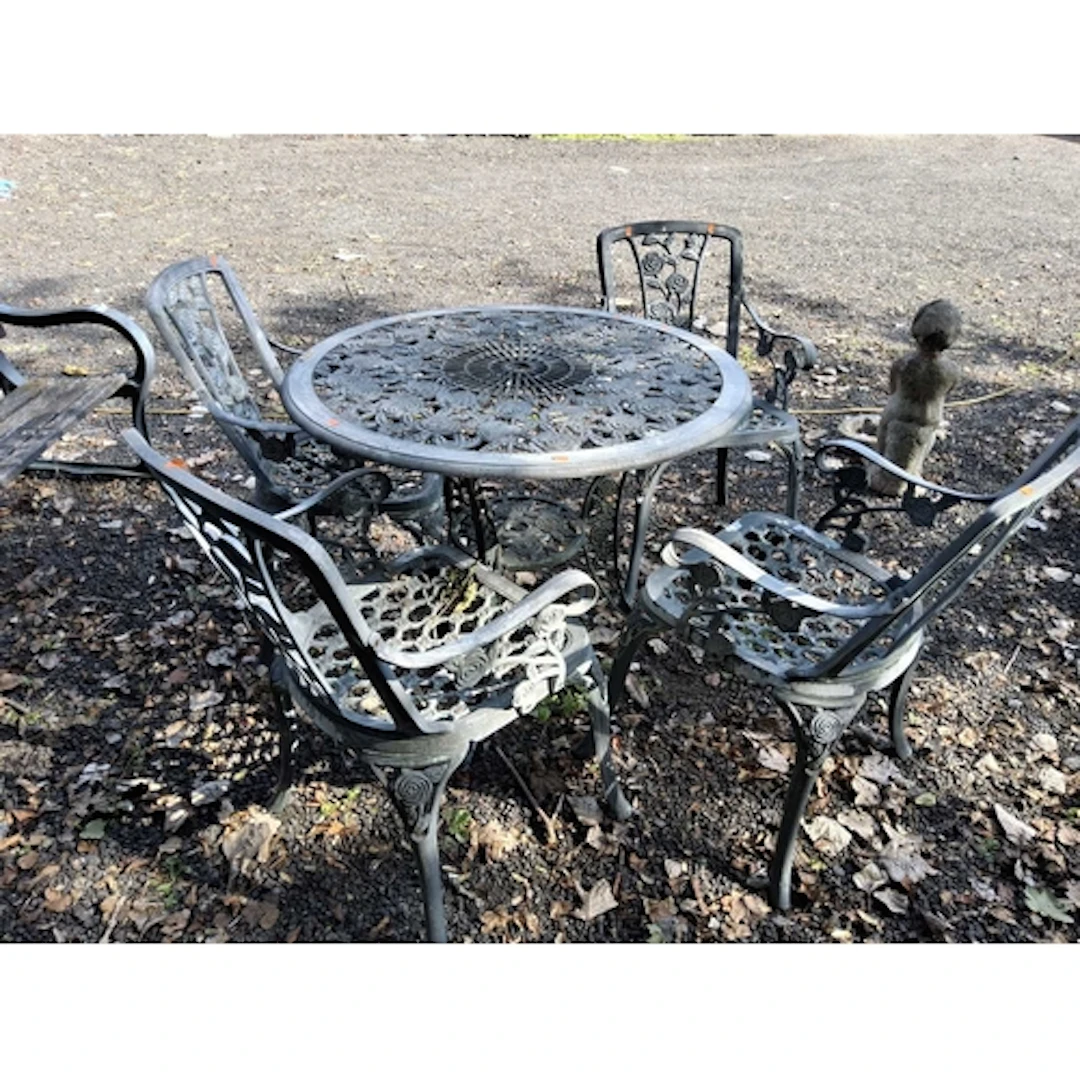 A CAST ALUMINIUM GARDEN TABLE AND FOUR SIMILAR CHAIRS with f...