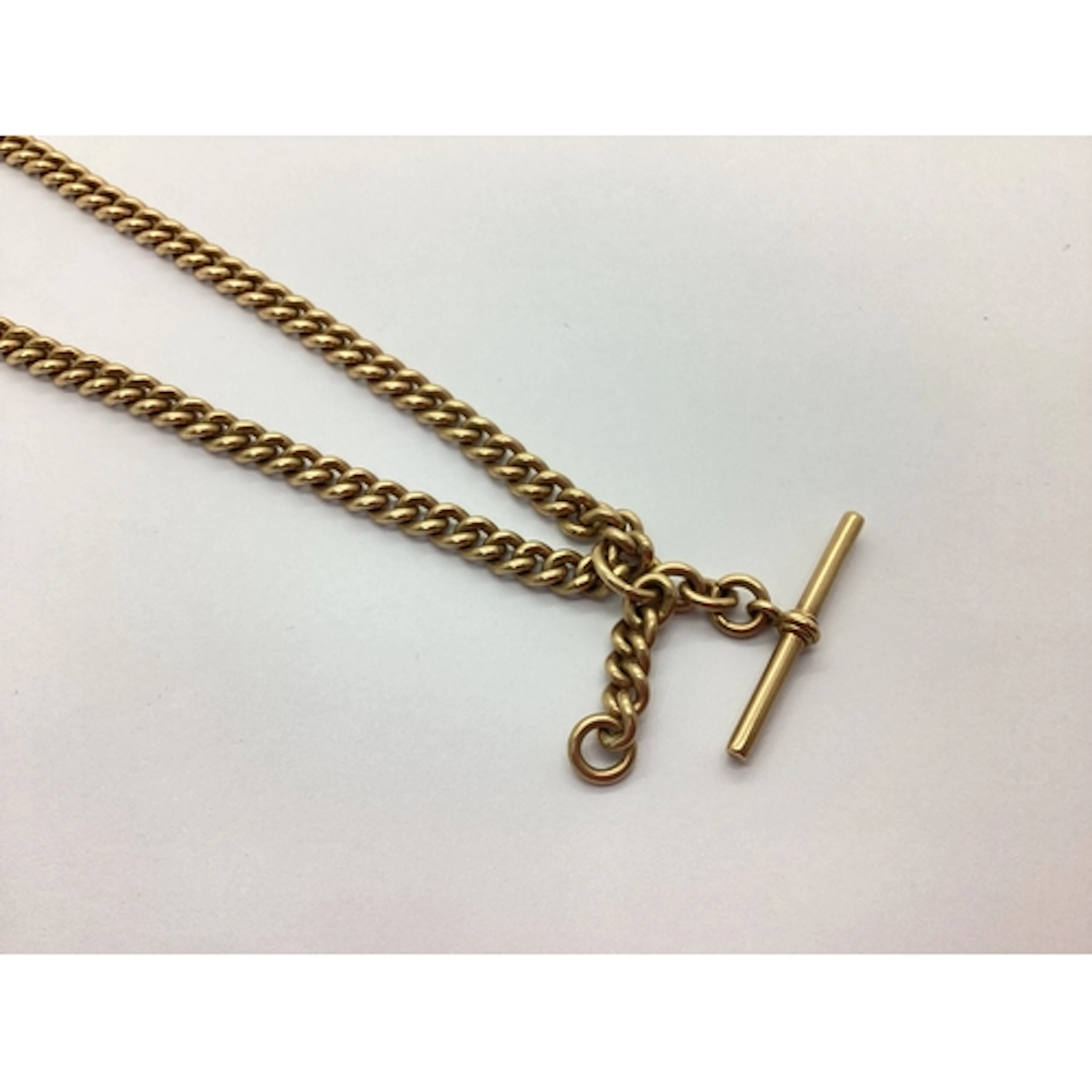 A Curb Link Pocket Watch Chain, of uniform design, to swivel...