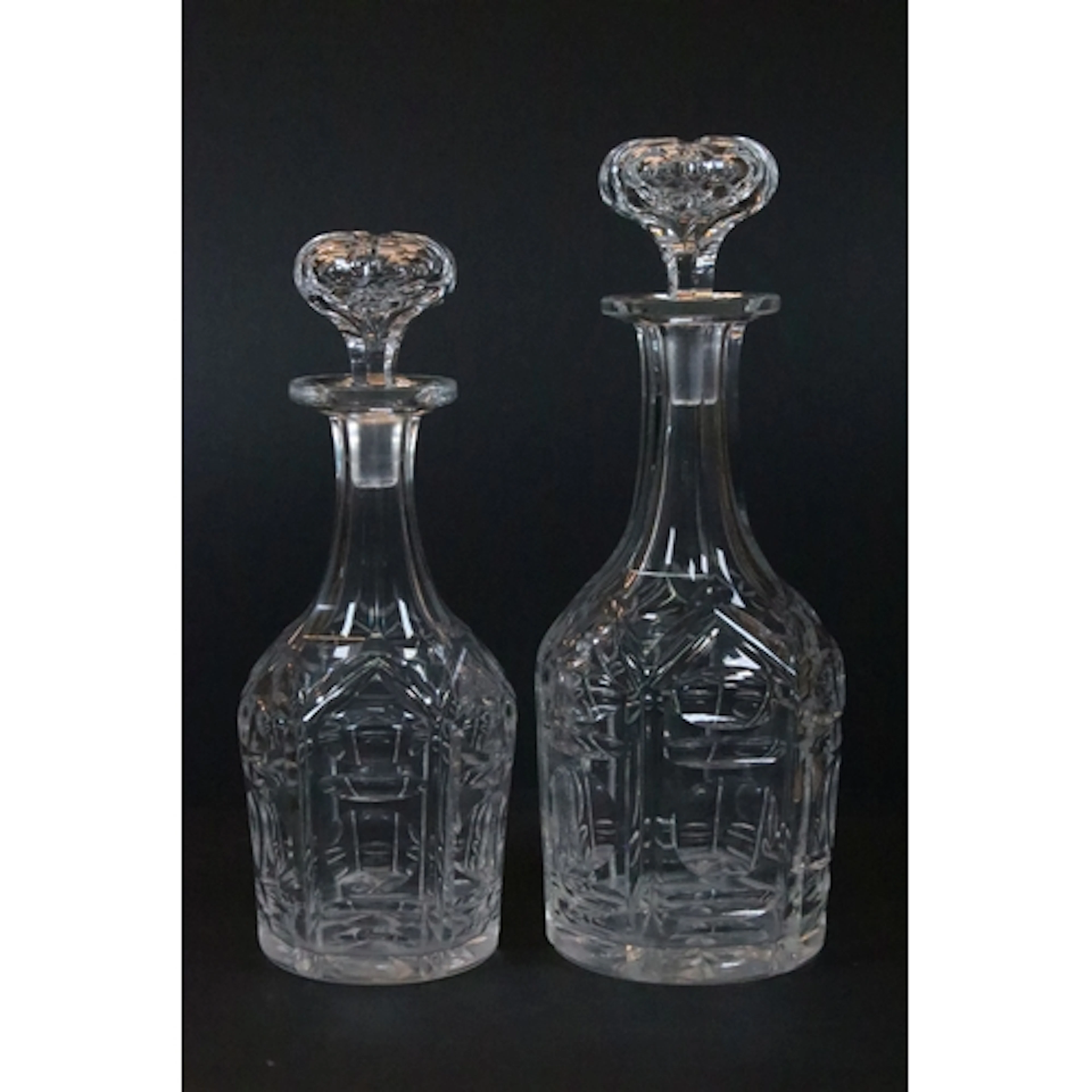 Two 19th century cut glass decanters, both with somewhat hex...