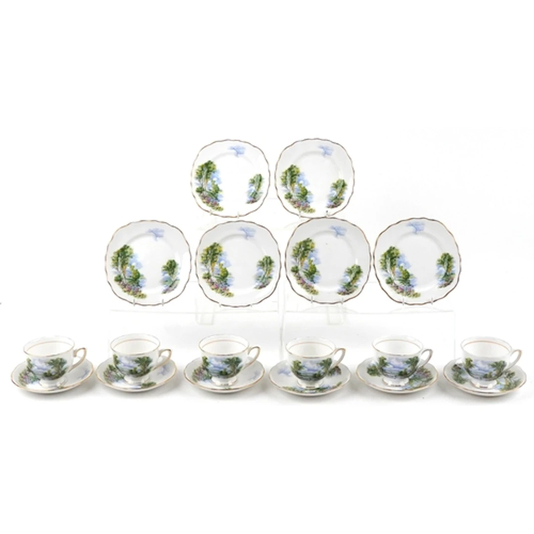 Colclough teaware including six trios decorated with landsca...