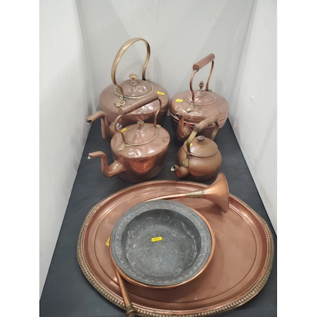 A collection of copperware including four Kettles, a Tray, a...
