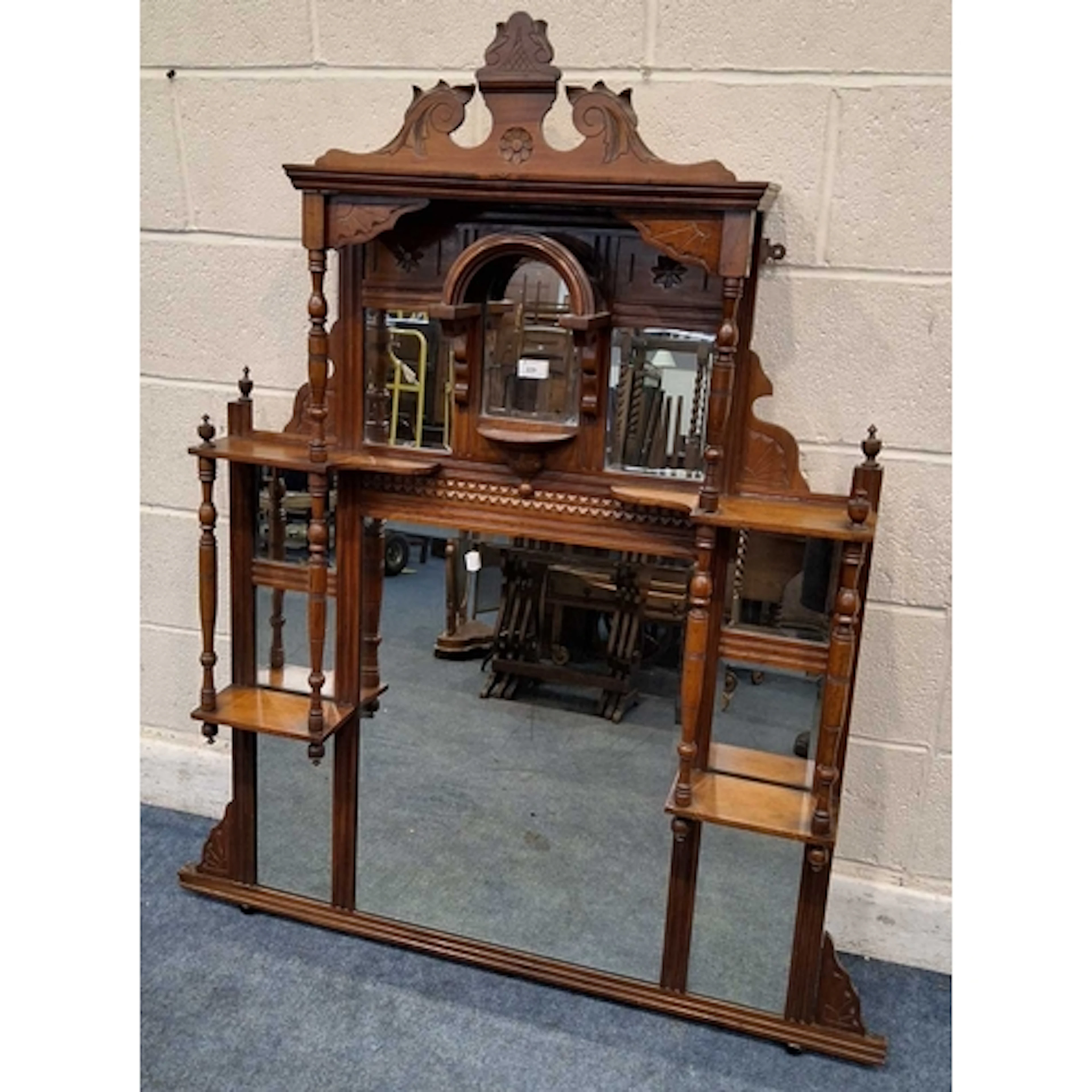 AN EARLY 20TH CENTURY OVERMANTEL MIRROR, with an arrangement...