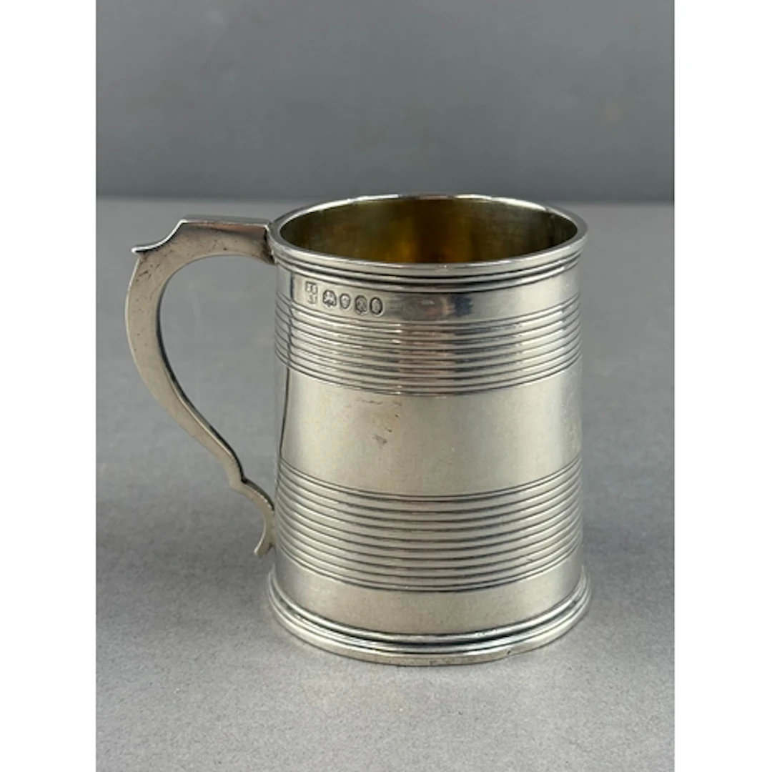 Silver: a tapering christening mug by Joseph & Albert Sa...