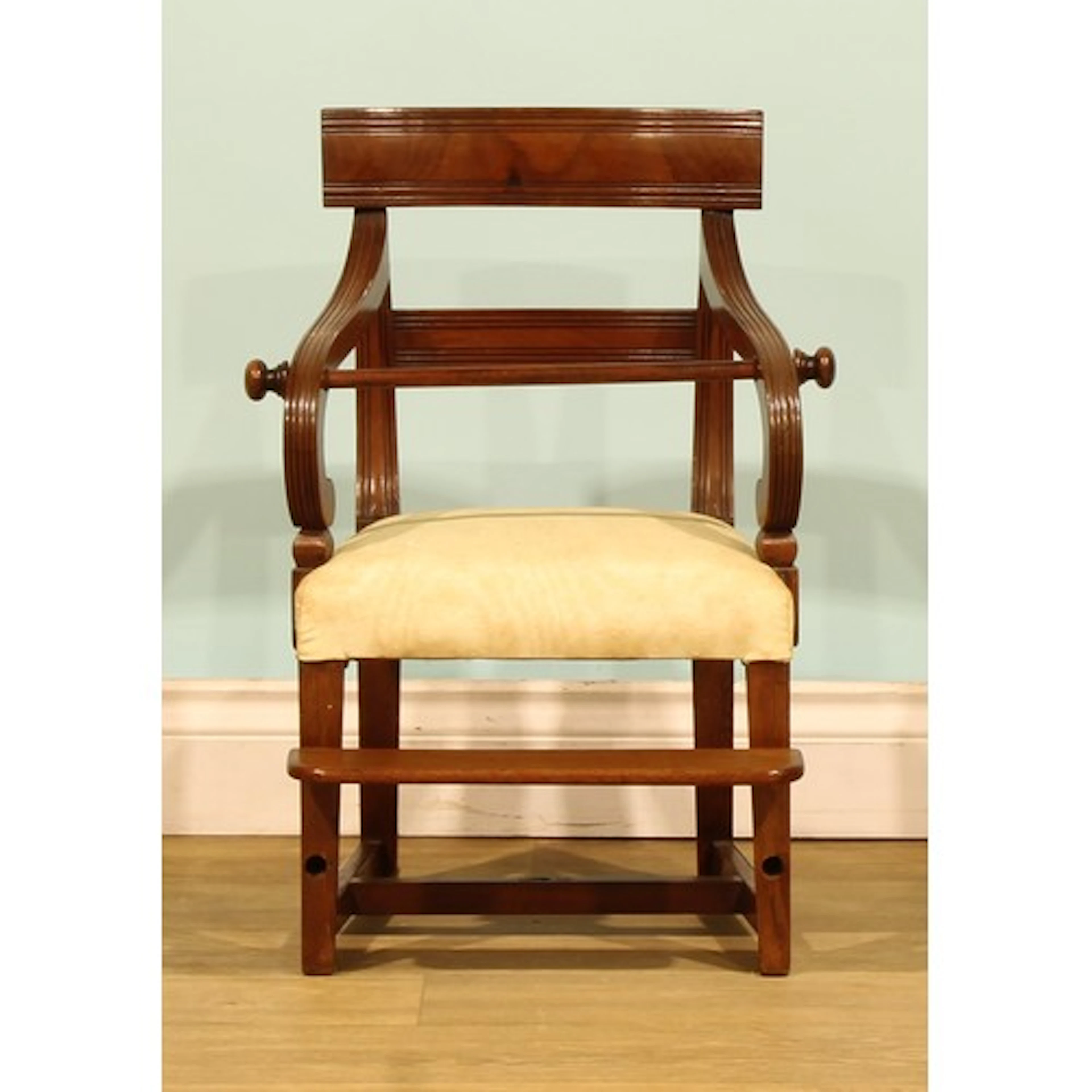A George IV mahogany child’s chair, reeded back and arms, he...