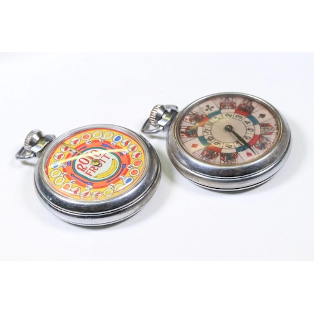 Two fruit machine and roulette pocket watch style watches in...