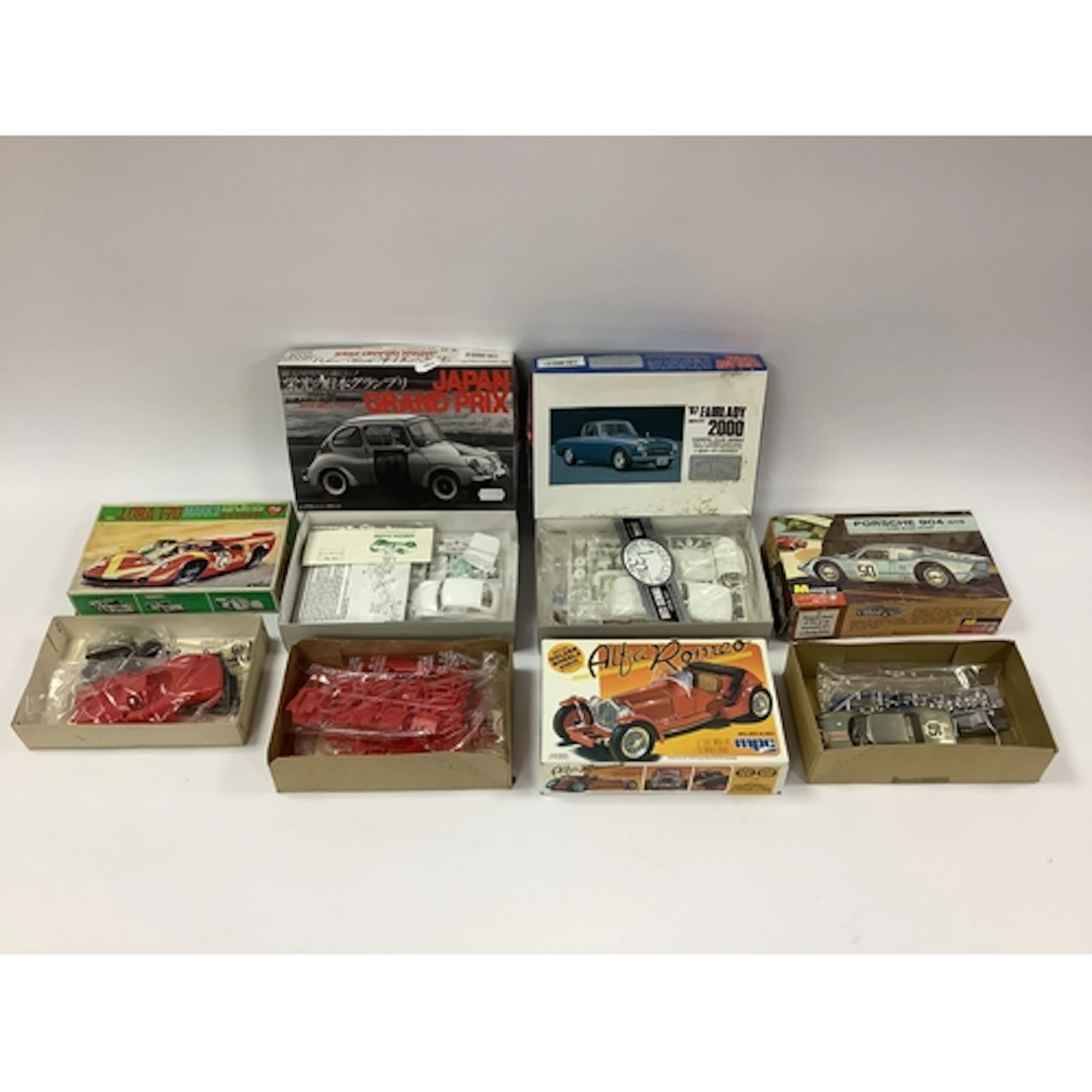 Five 1:32 scale plastic model car kits by Monogram, ARII, MP...