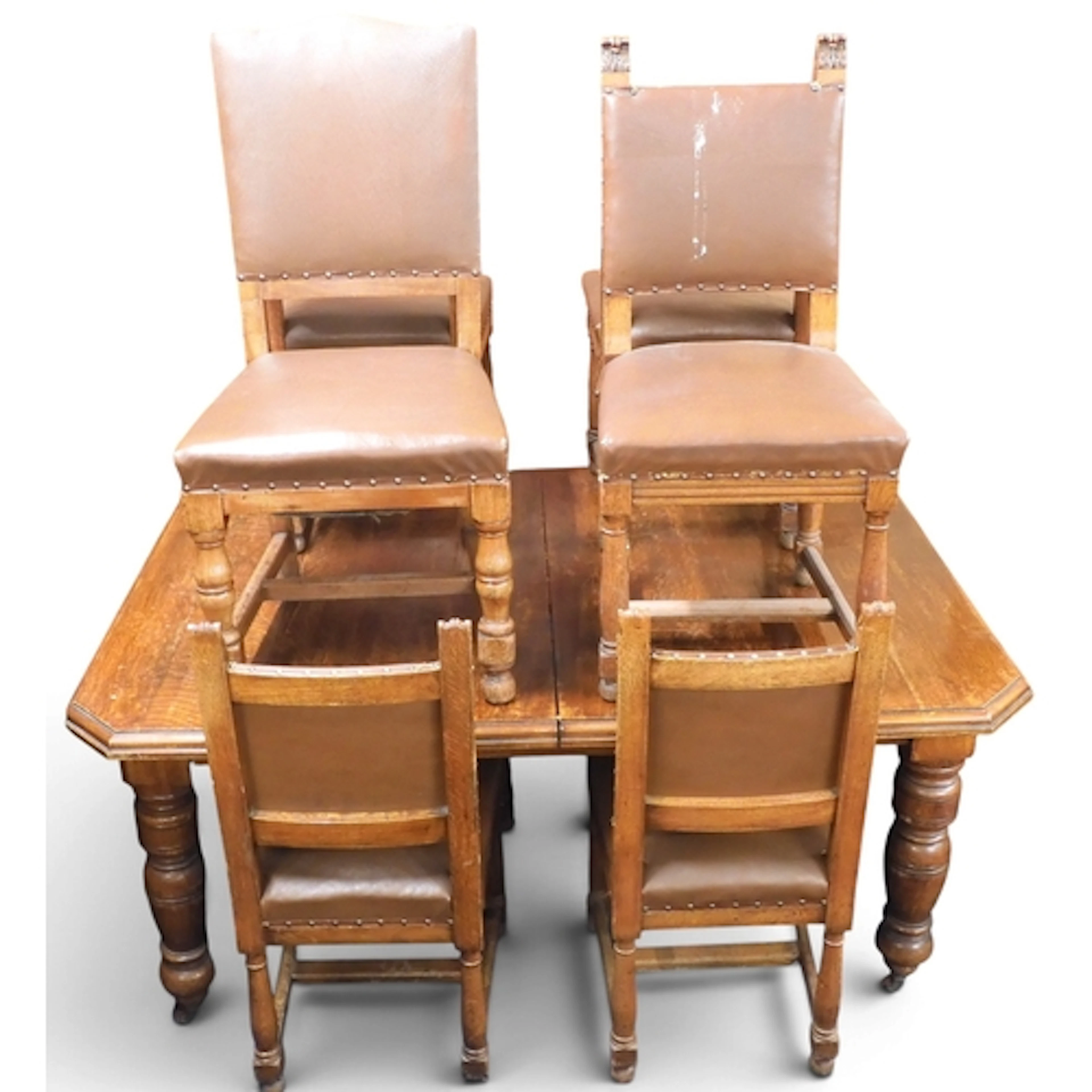 A large Victorian oak wind out extending dining table with a...