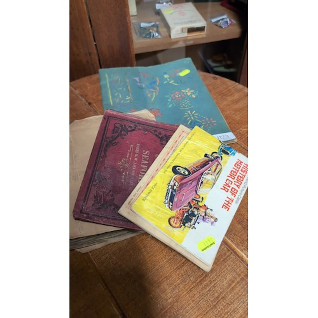 A group of albums and illustrated publications, including a ...