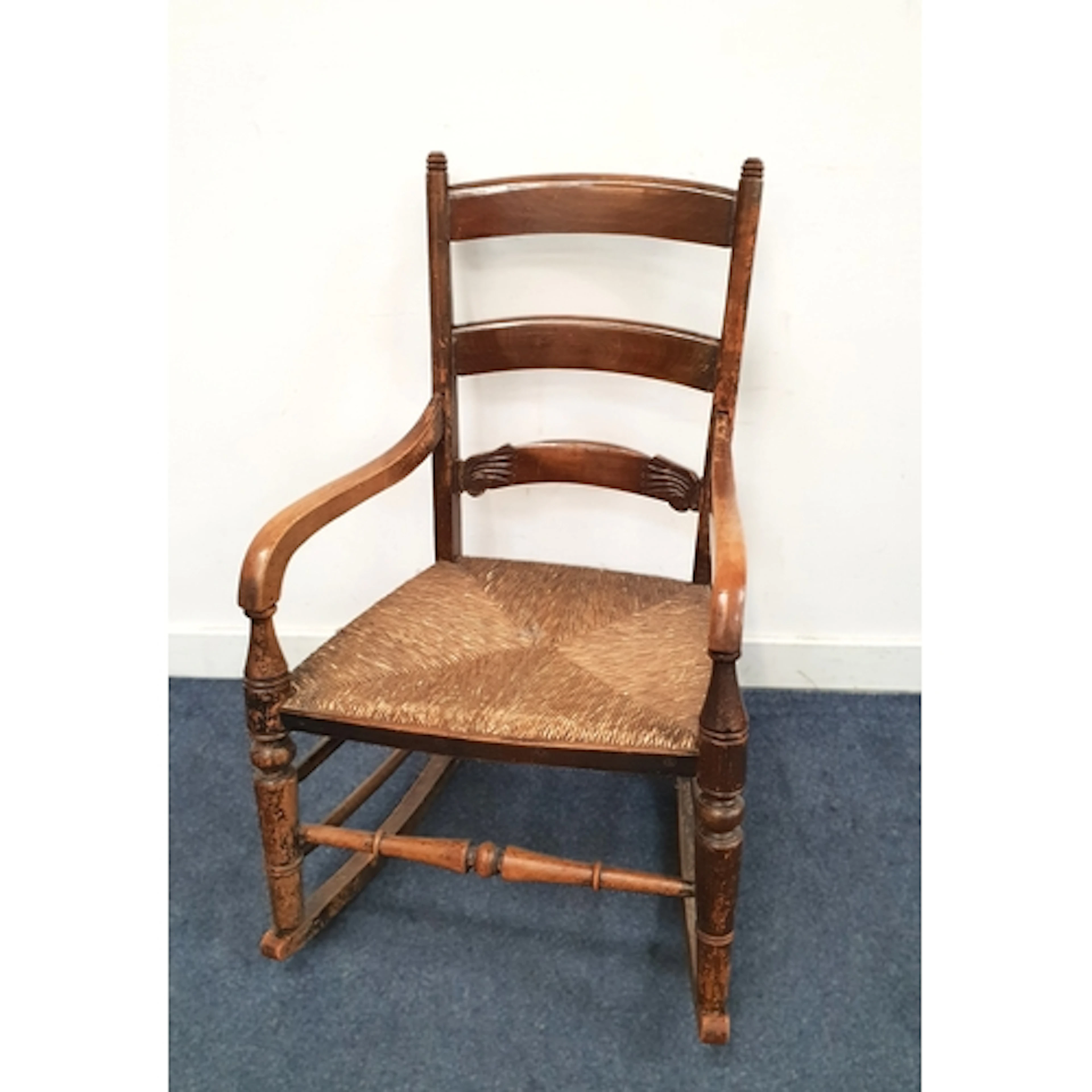MID 19th CENTURY LADDER-BACK ELM ROCKING CHAIR the three-sla...