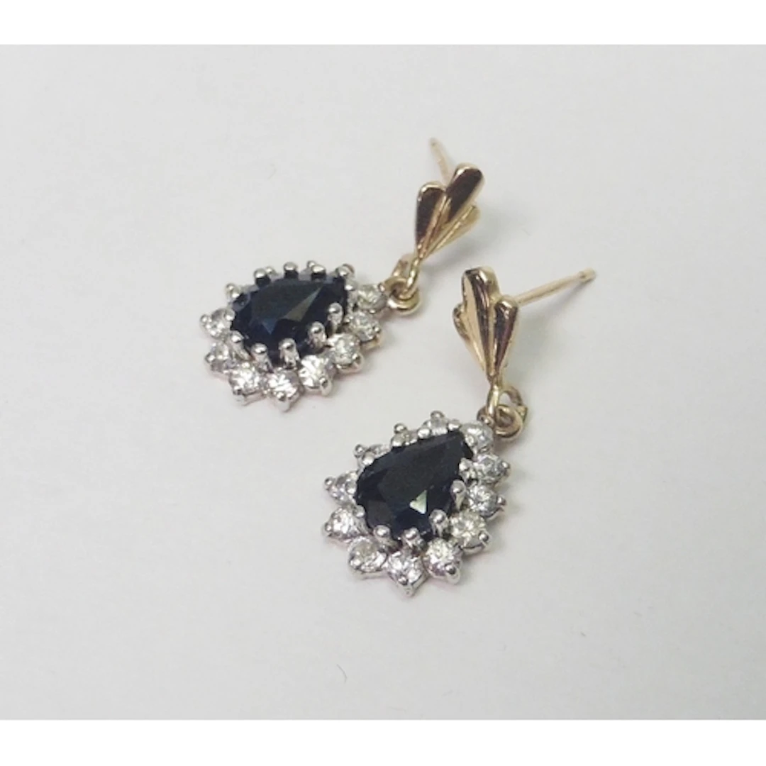 A pair of pear-shaped droplet earrings 9ct gold set with sap...