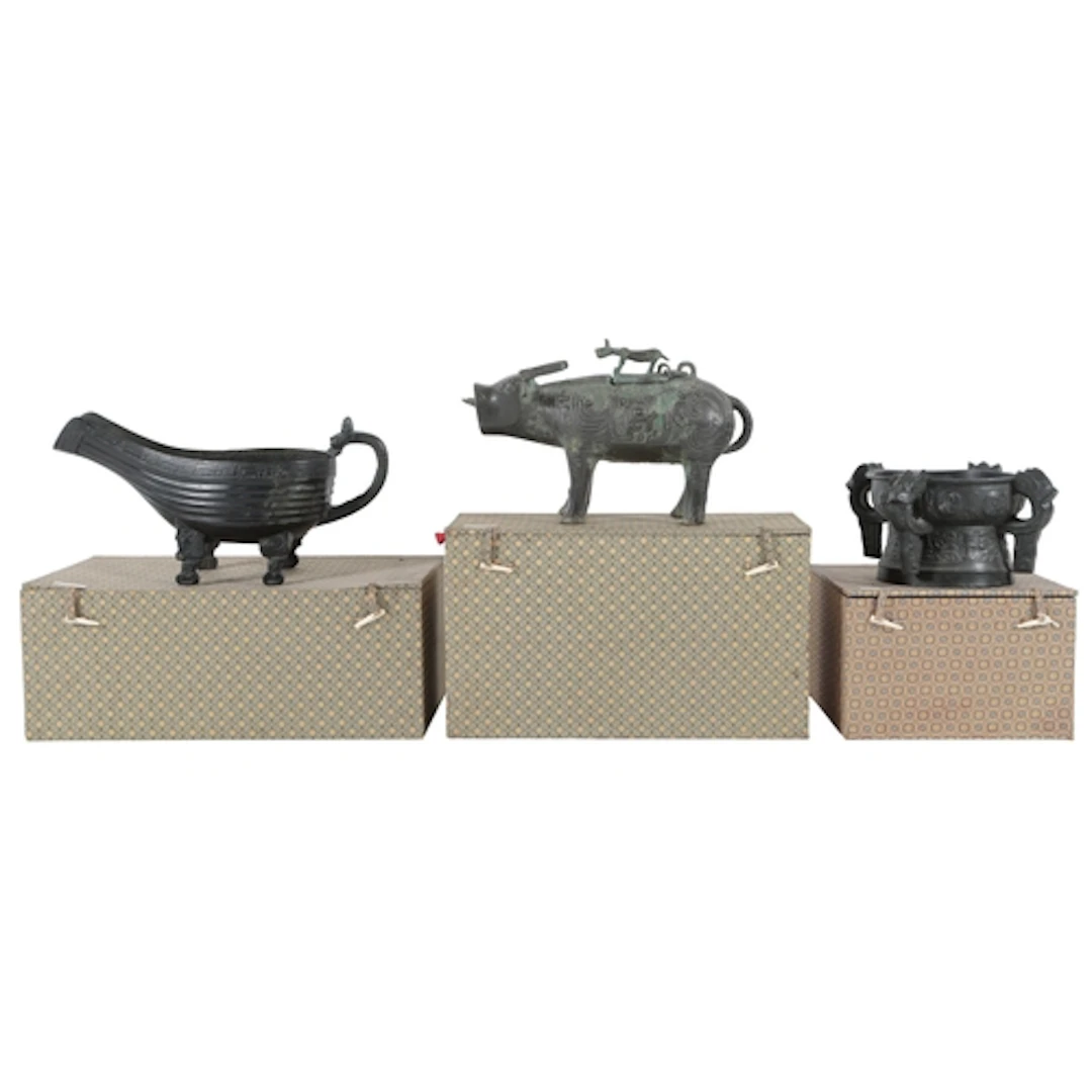 Three Chinese patinated bronze archaistic models of a buffal...