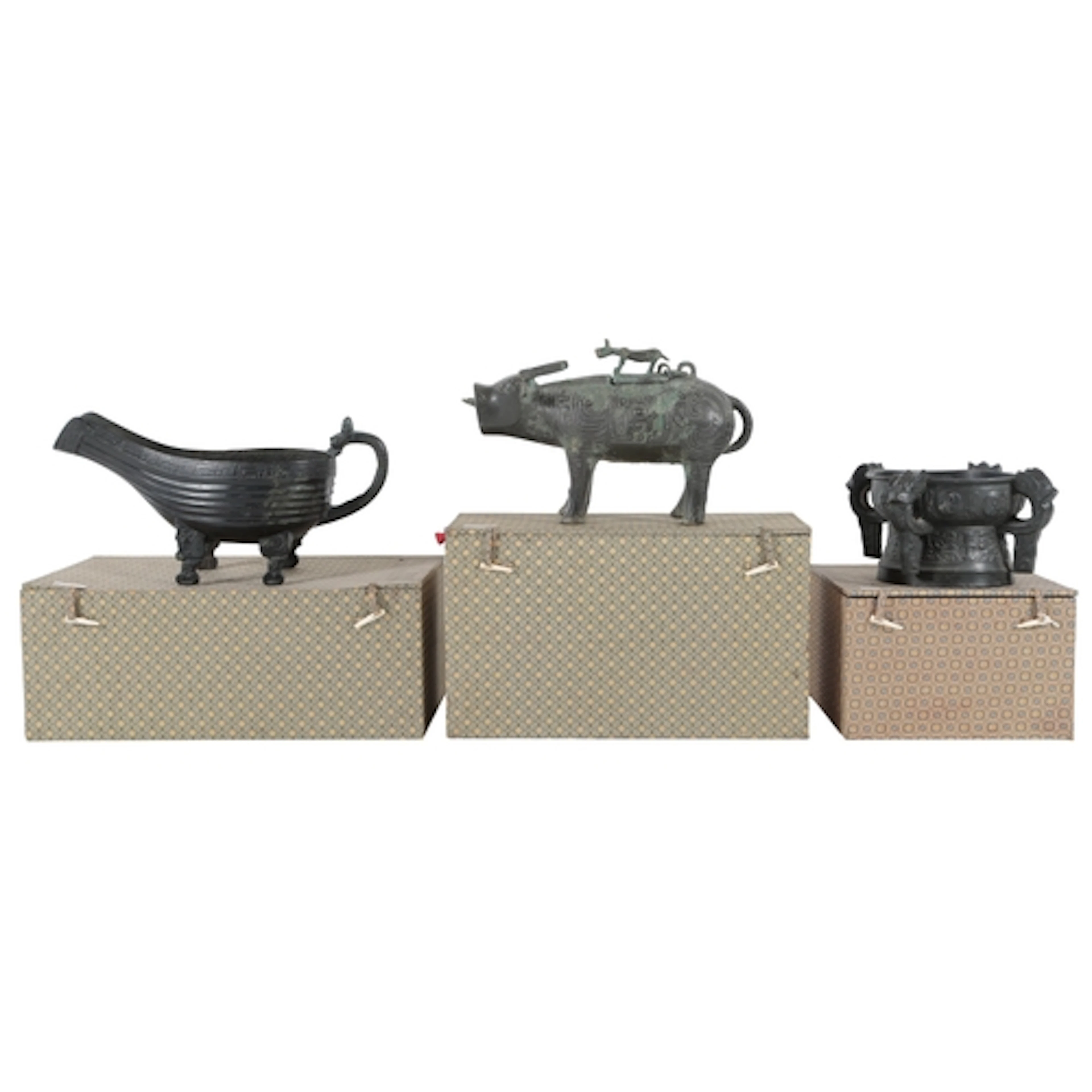 Three Chinese patinated bronze archaistic models of a buffal...