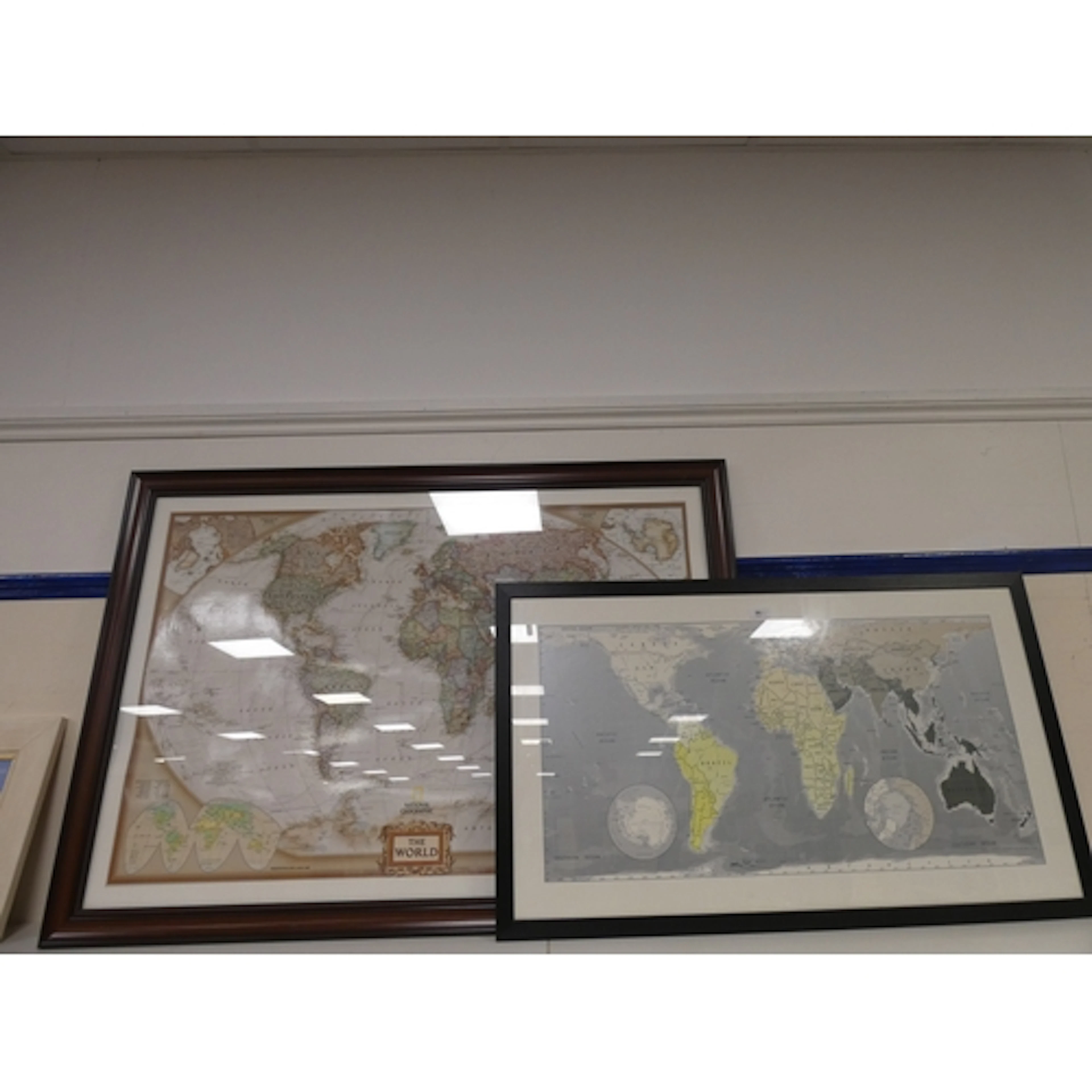 National Geographic large map of the world, and another simi...