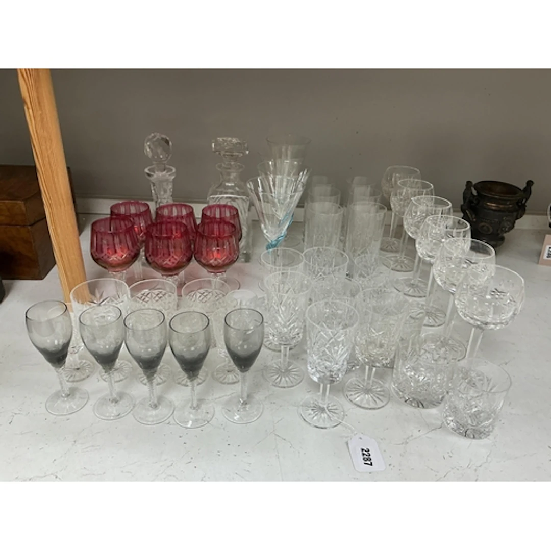A collection of drinking glasses to include a set of six cra...
