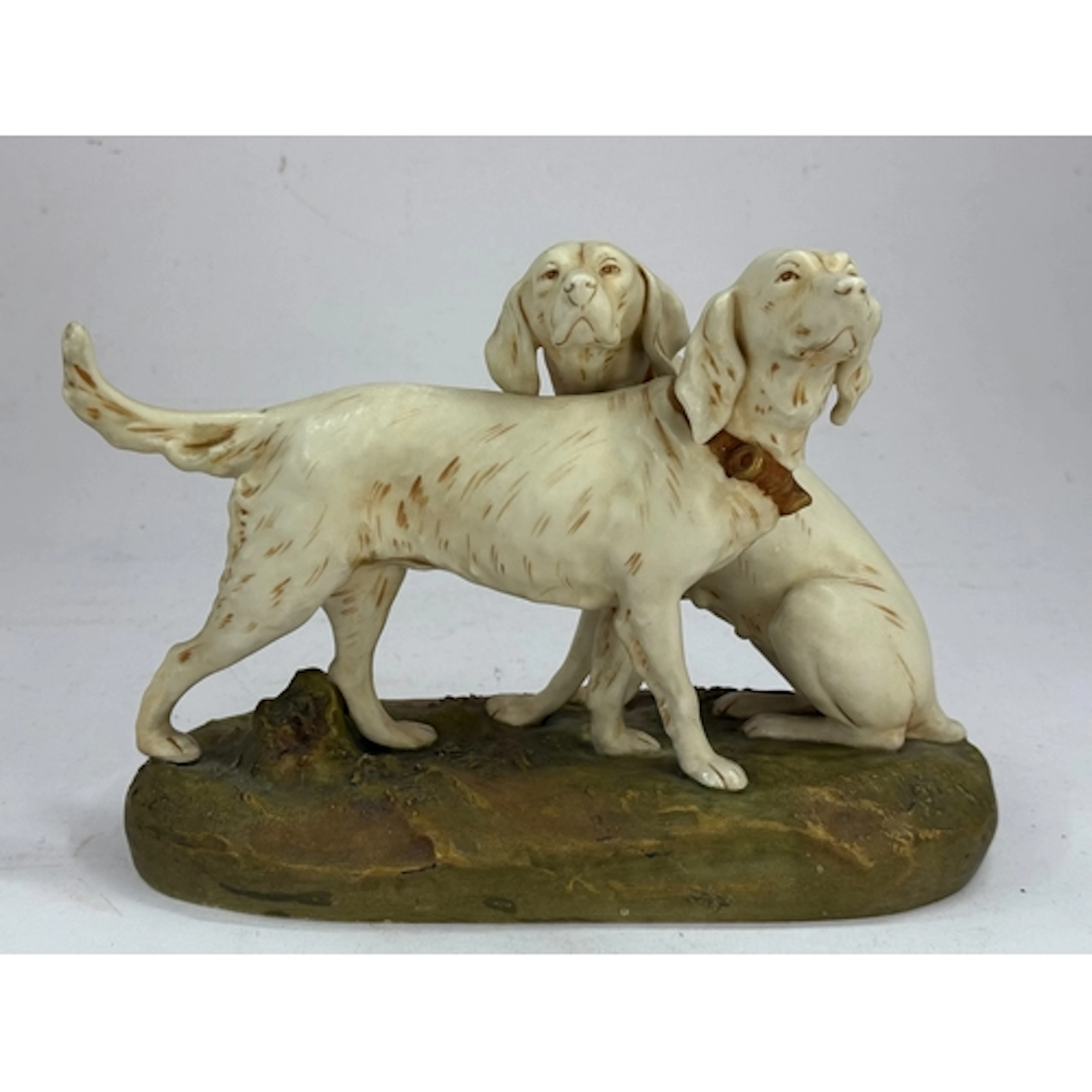 A Royal Dux figure group of two gun dogs, 1st half 20th cent...
