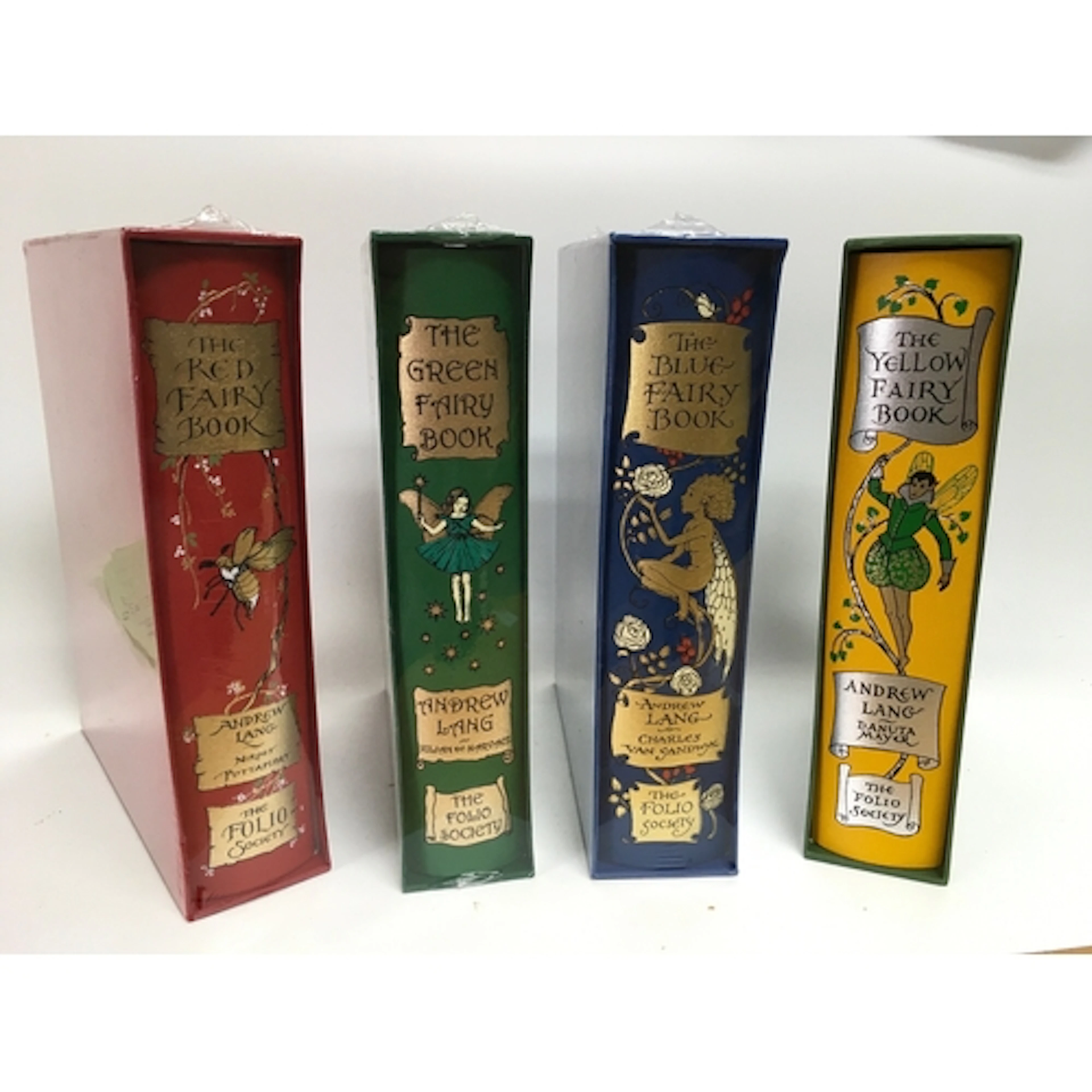 An assortment of The Folio Society books including the green...