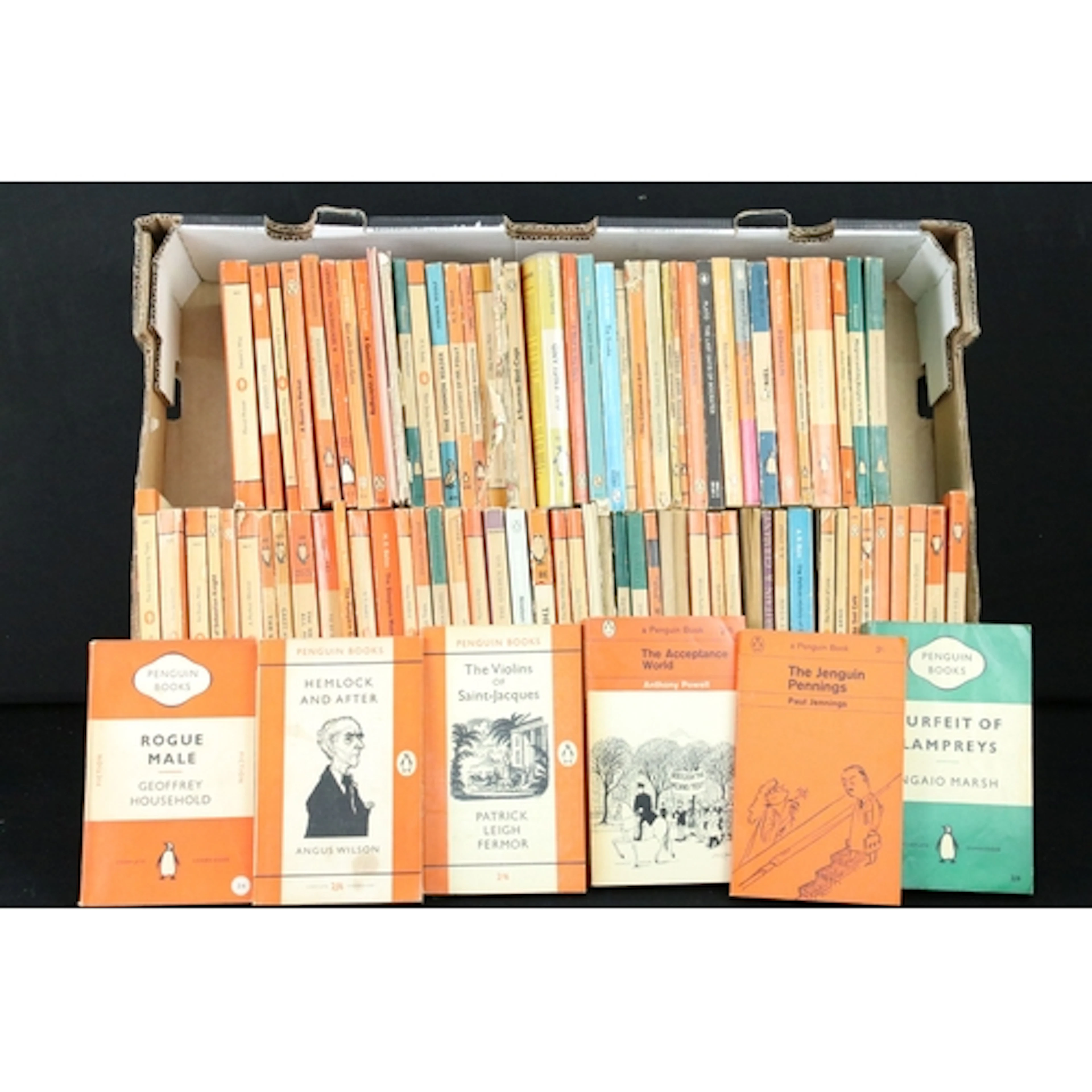 A large collection of vintage Penguin paperback books.