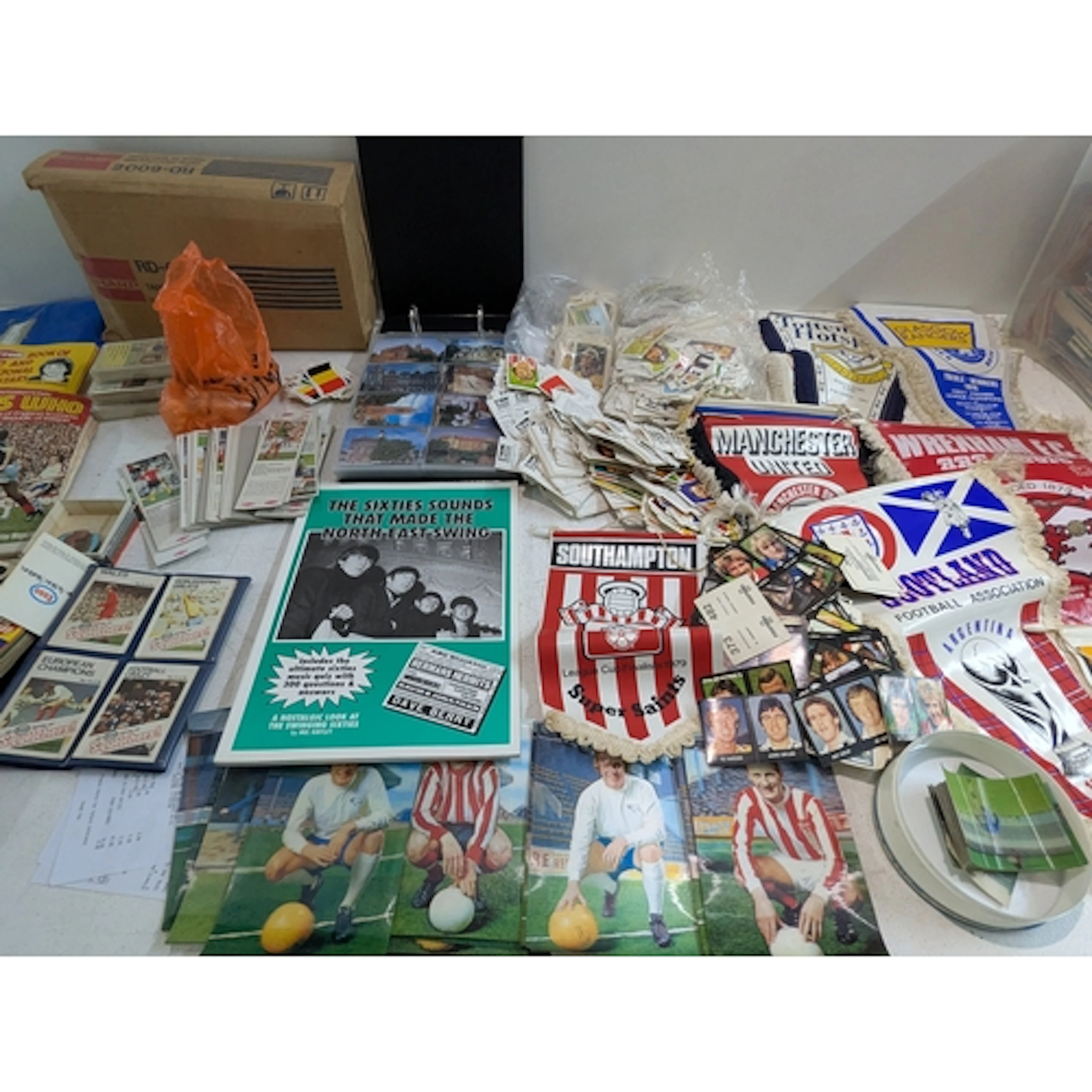A mixed lot of mainly football related items to include flag...