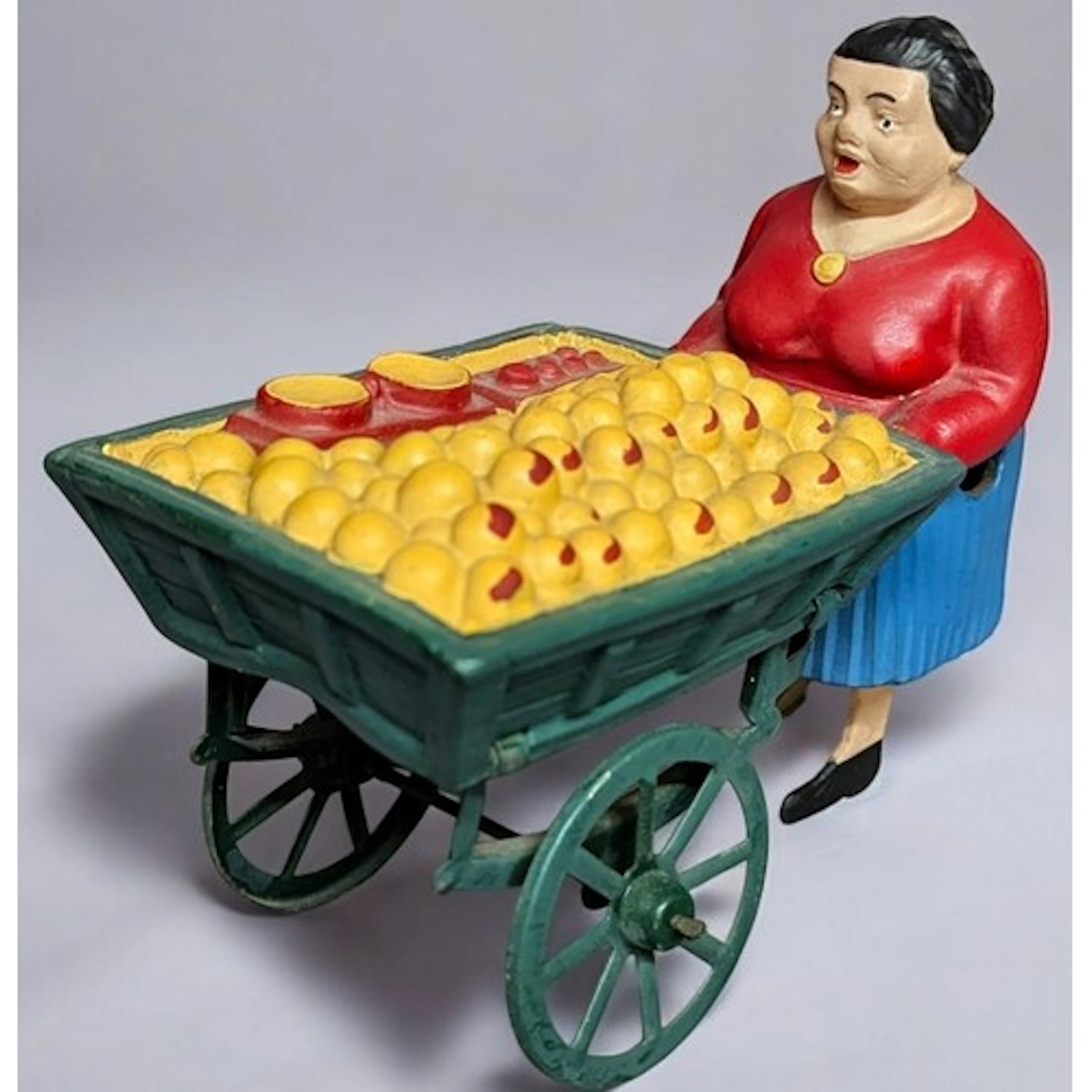 An unusual French clockwork tinplate toy, Orange Seller’s Ca...