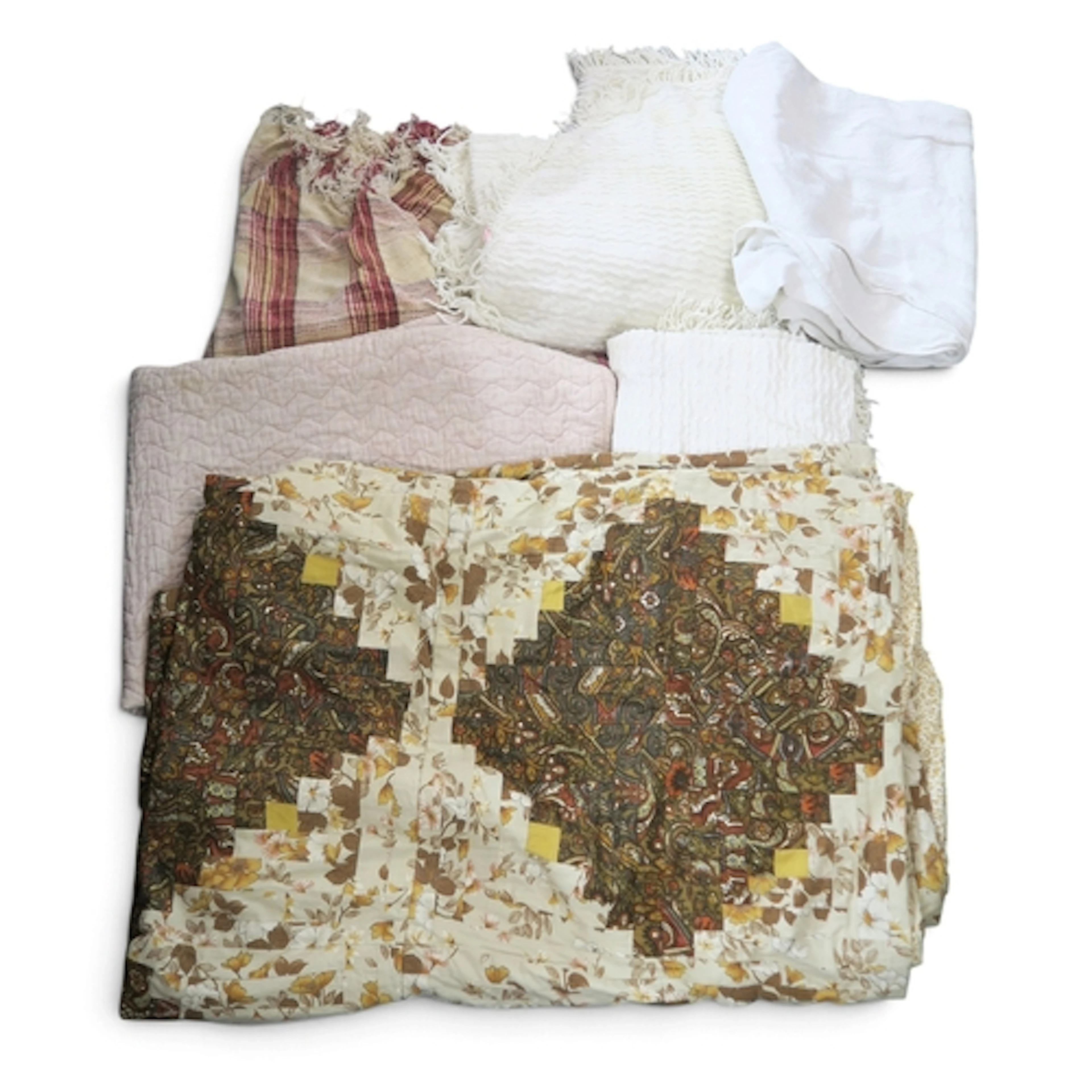 A patchwork bedspread worked in geometric diamond shapes, a ...