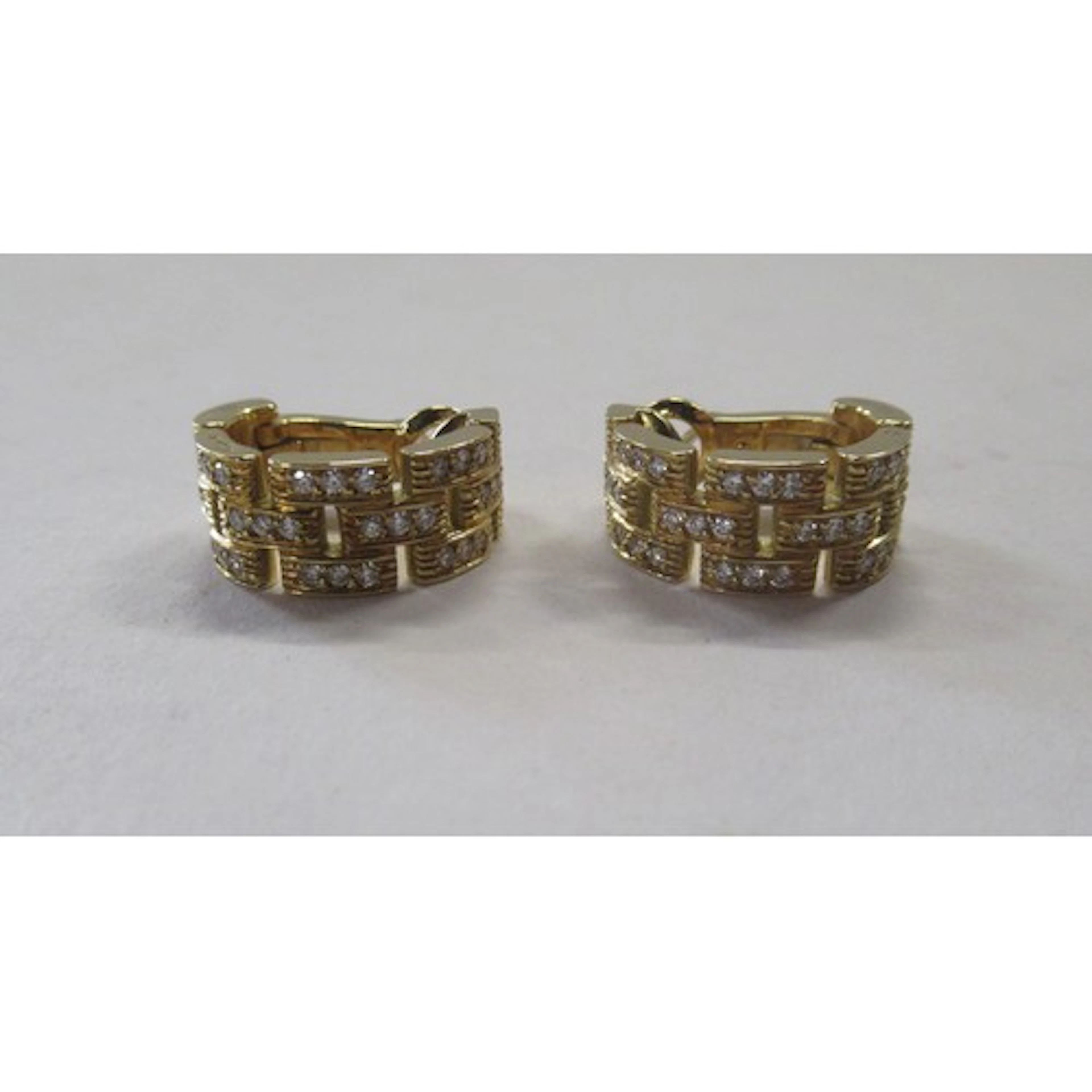 A pair of Cartier 18k yellow gold and diamond Maillon Panthe...