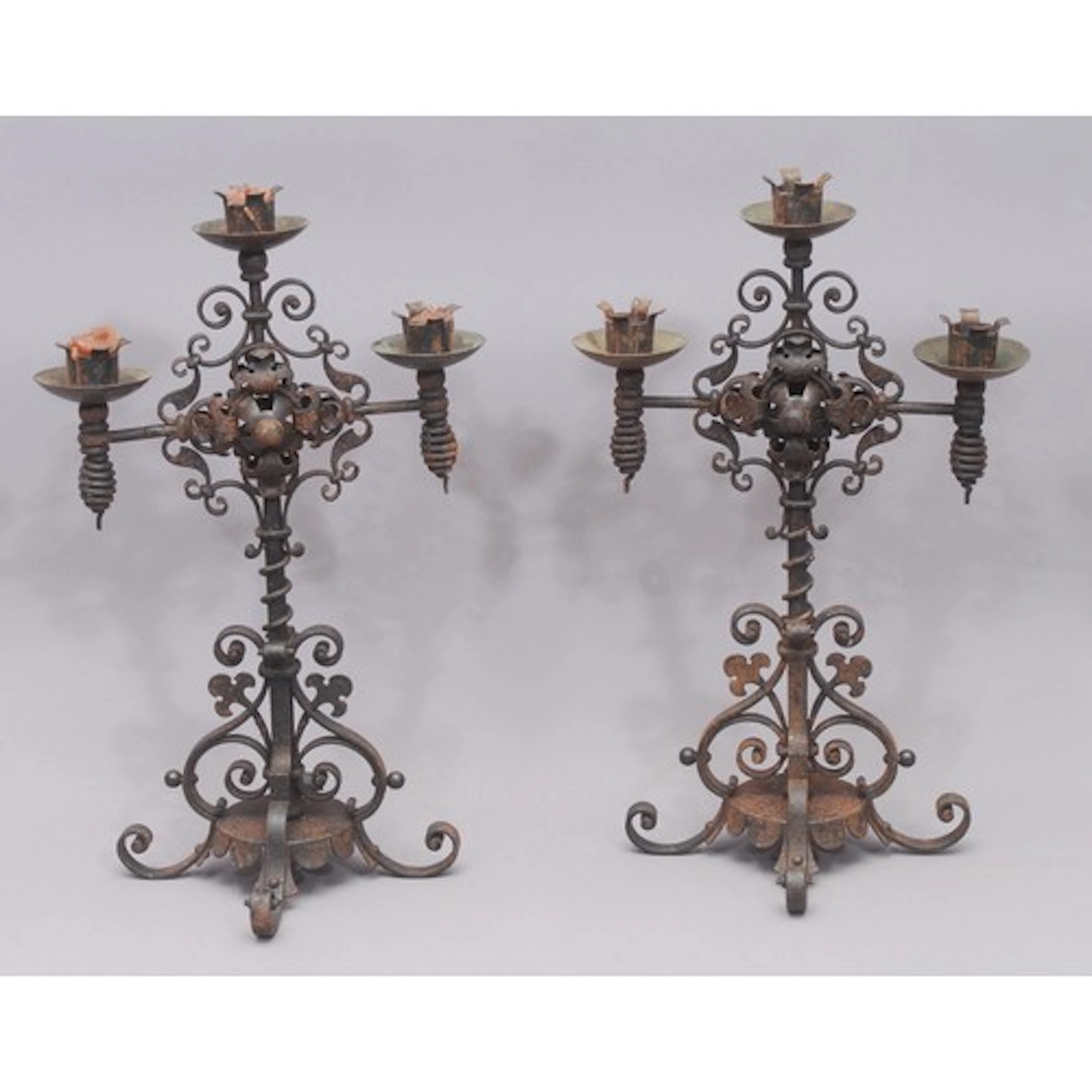 A pair of Northern Renaissance Revival cast iron three-light...