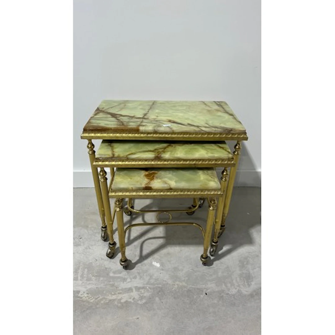 Nest of Italian style onyx topped tables of graduated form, ...