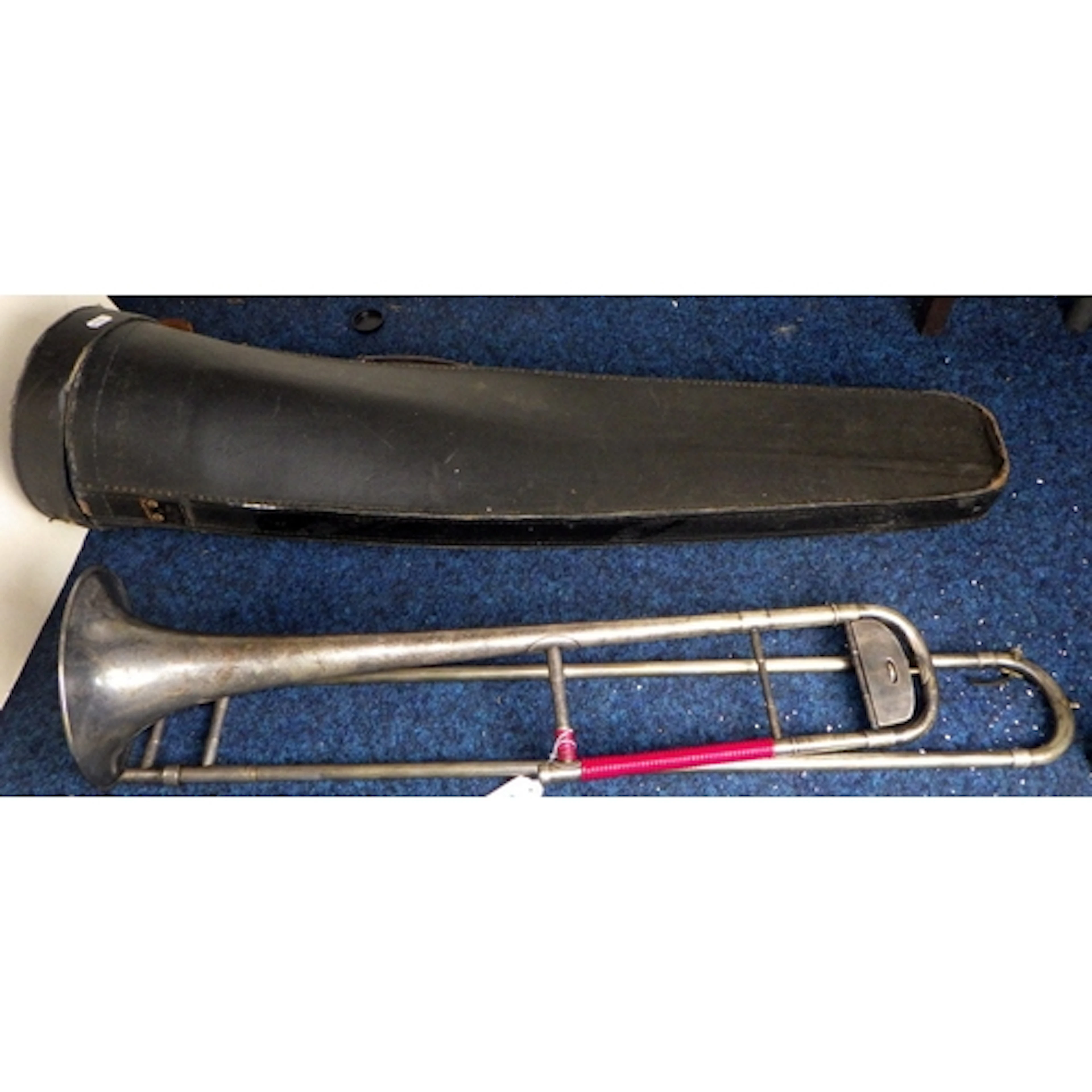 A cased Boosey & Hawkes silver plated trombone af