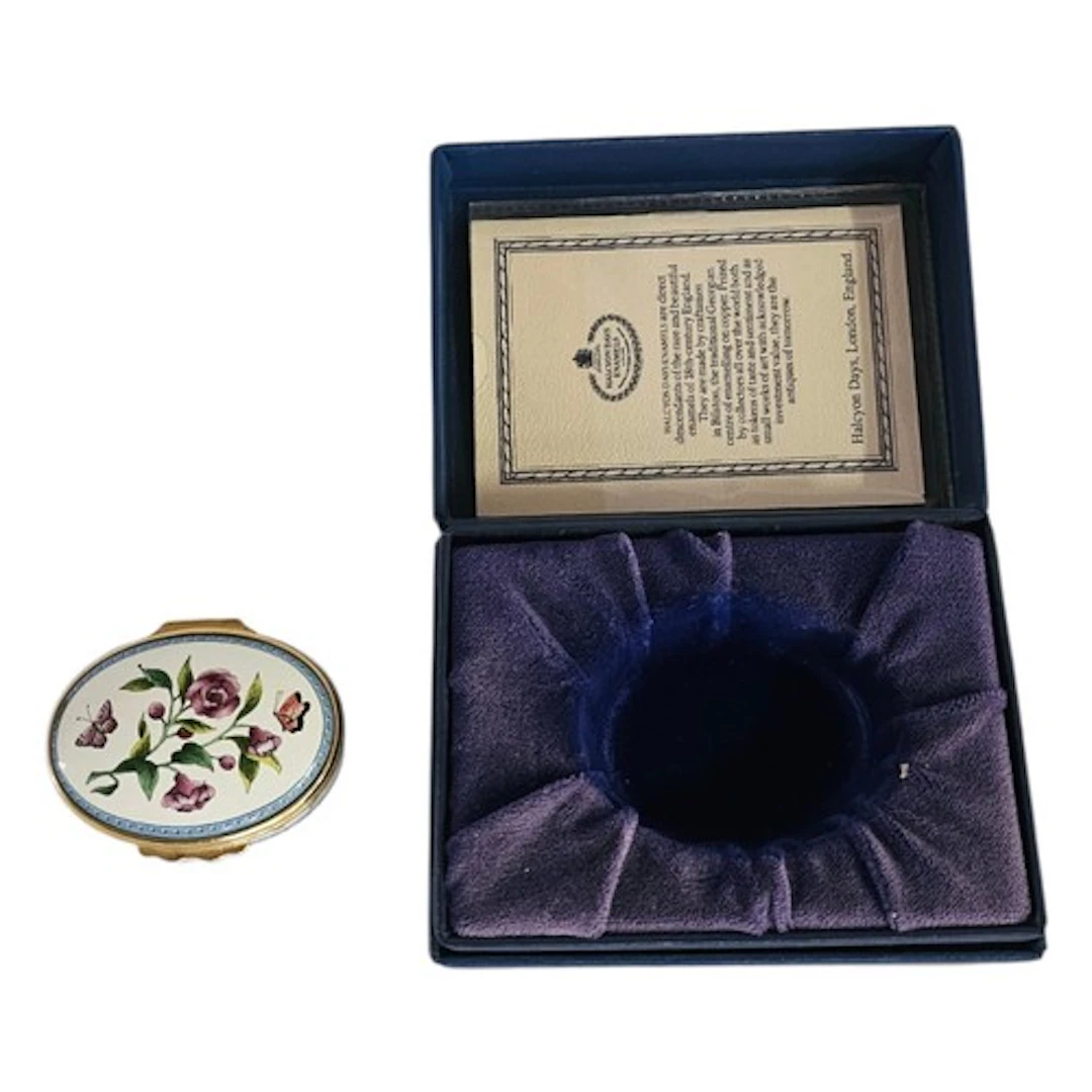 HALCYON DAYS ENAMELS, A VINTAGE HINGED OVAL TRINKET BOX Comp...