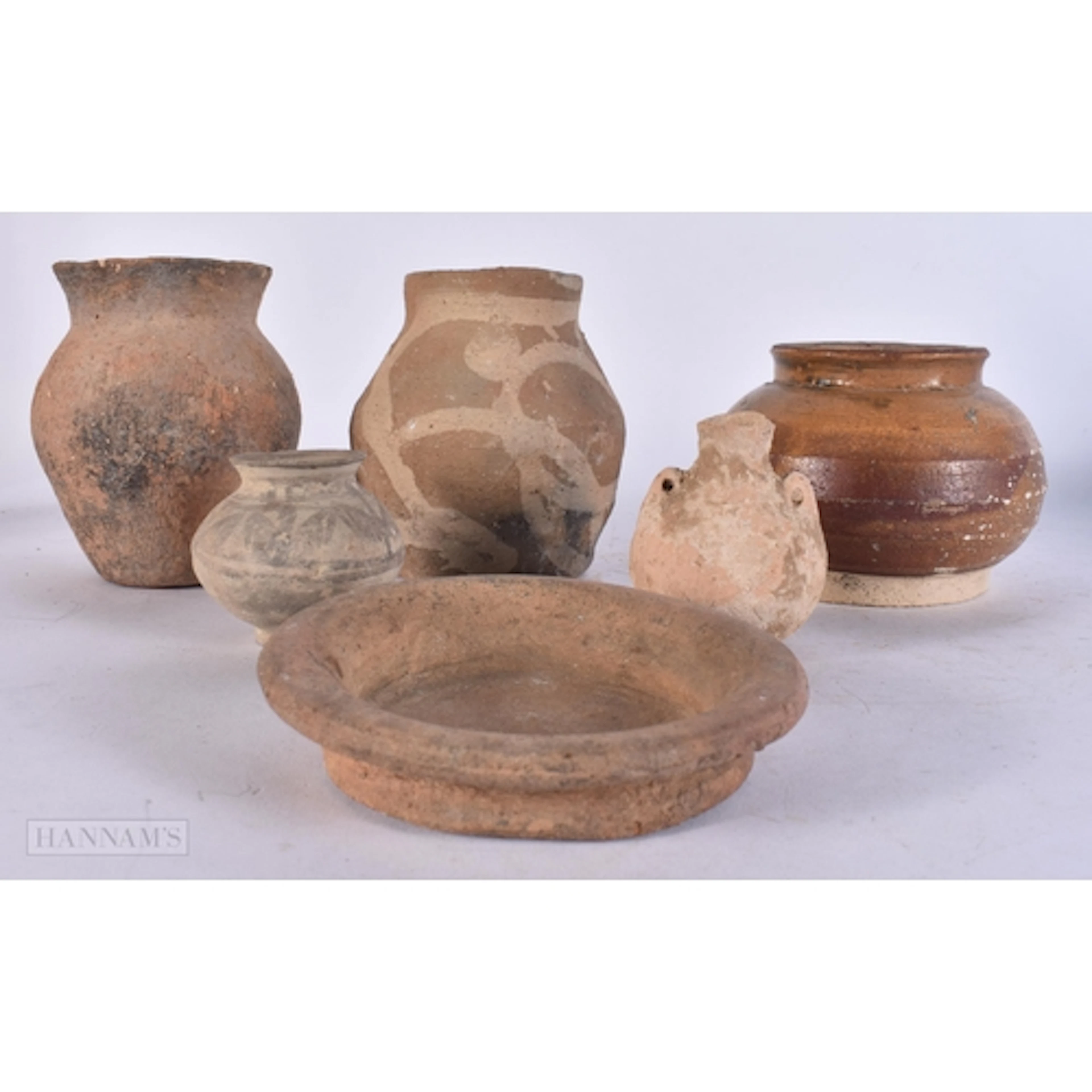 SIX CHINESE POTTERY VESSELS Han Dynasty and later. (6)