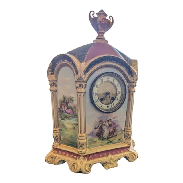 A 19th century Bohemian porcelain mantel clock. With gilt de...