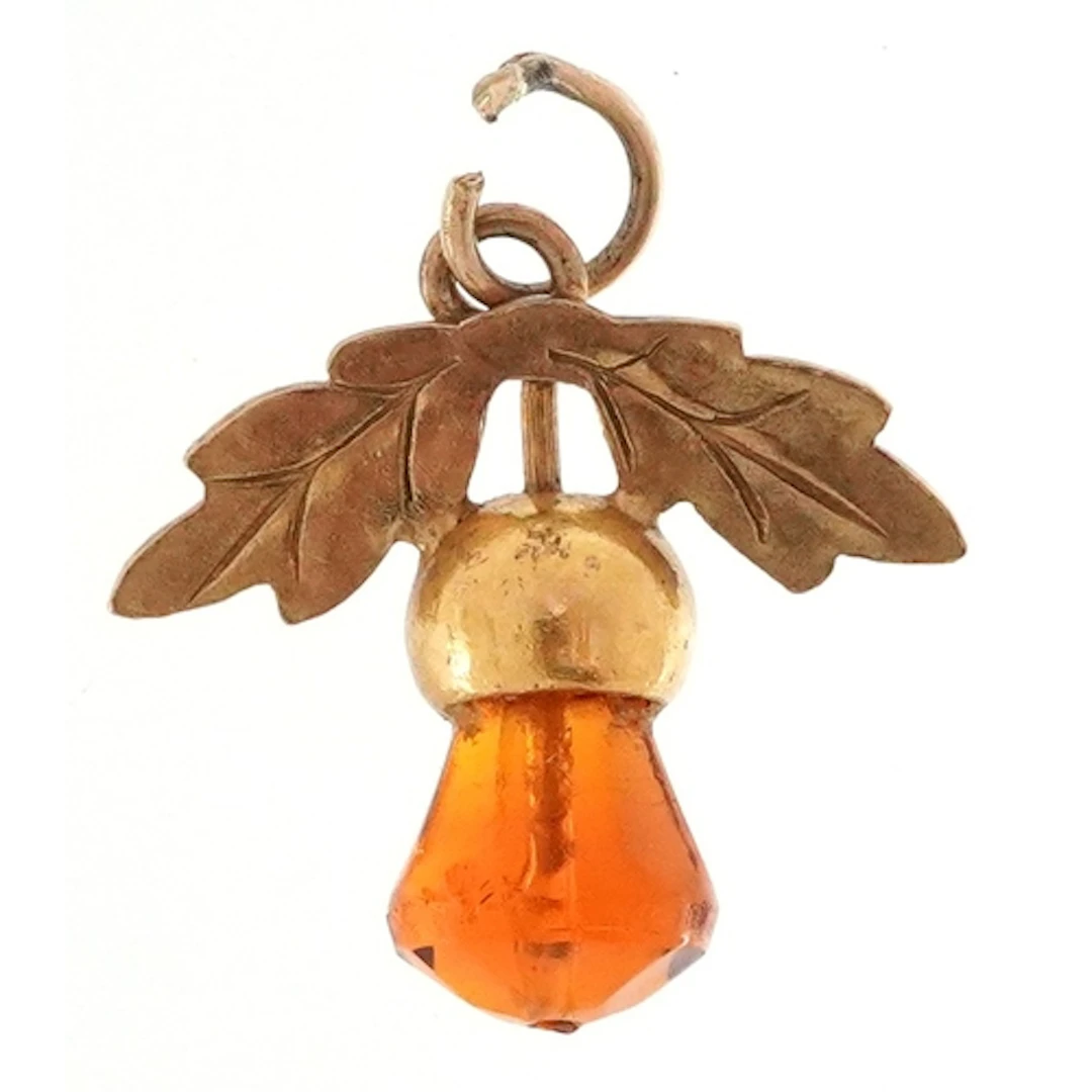 9ct gold amber coloured thistle pendant, 1.5cm high, 0.9g.