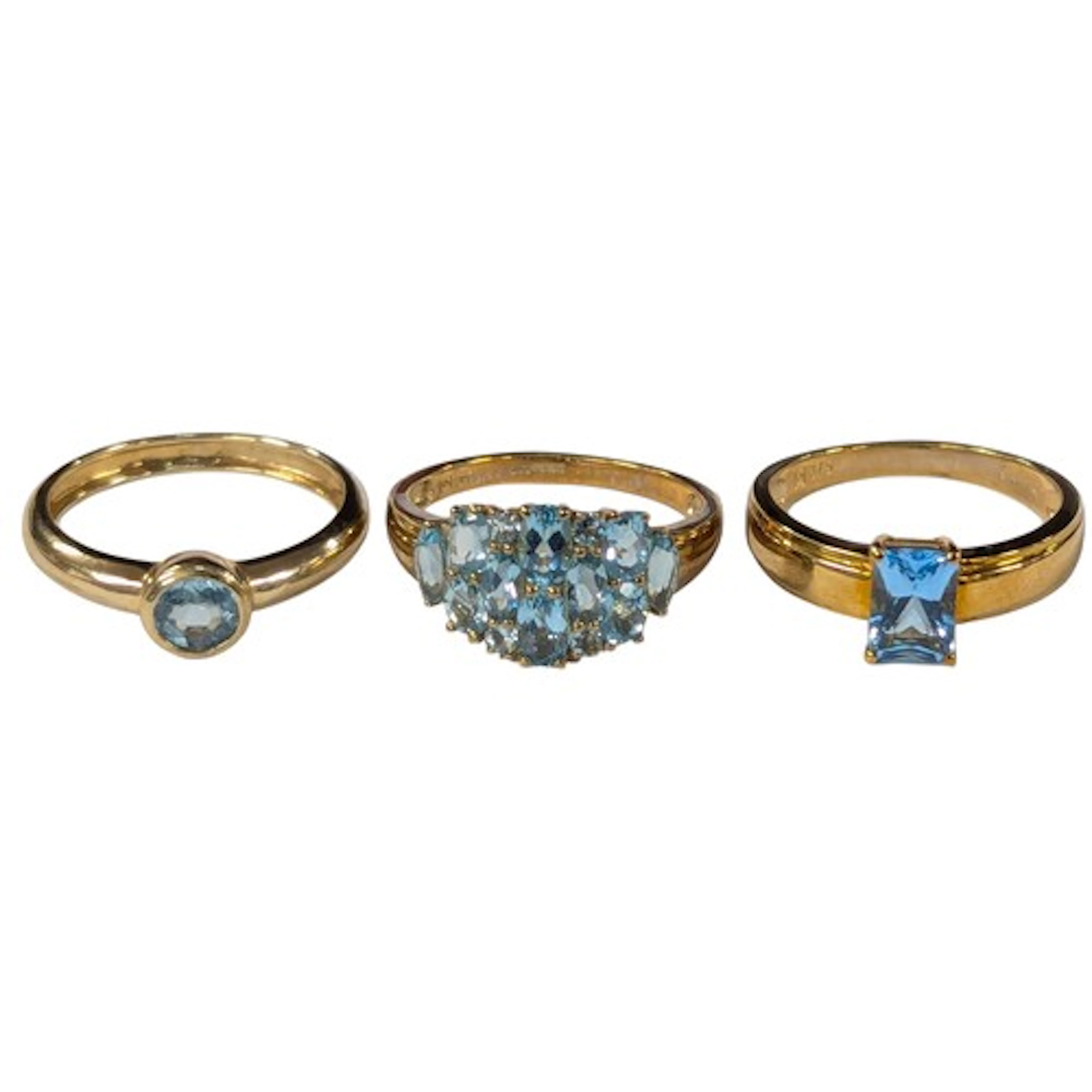 A 9ct gold Qvc blue topaz dress ring, size O, two other Qvc ...