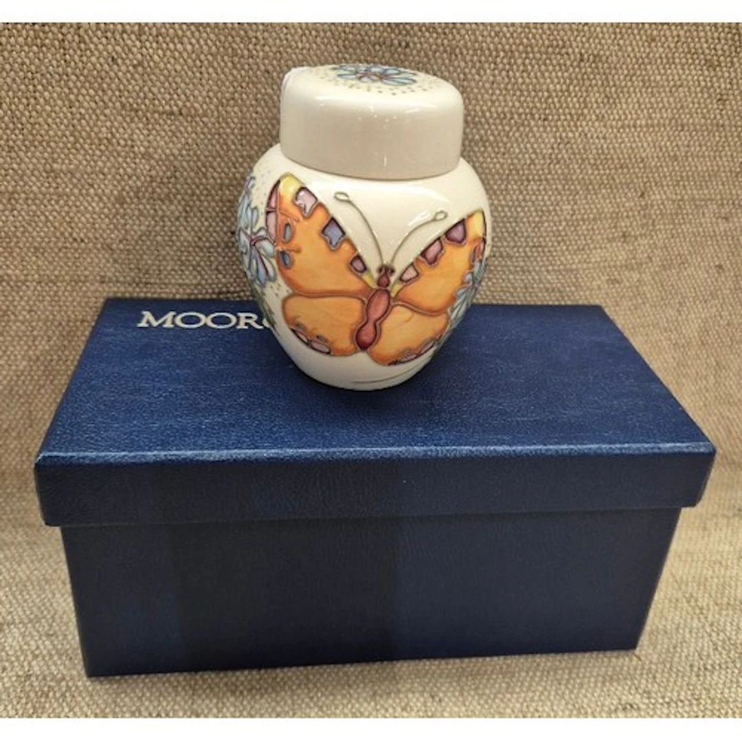 A boxed Moorcroft ginger jar with butterfly design, height w...