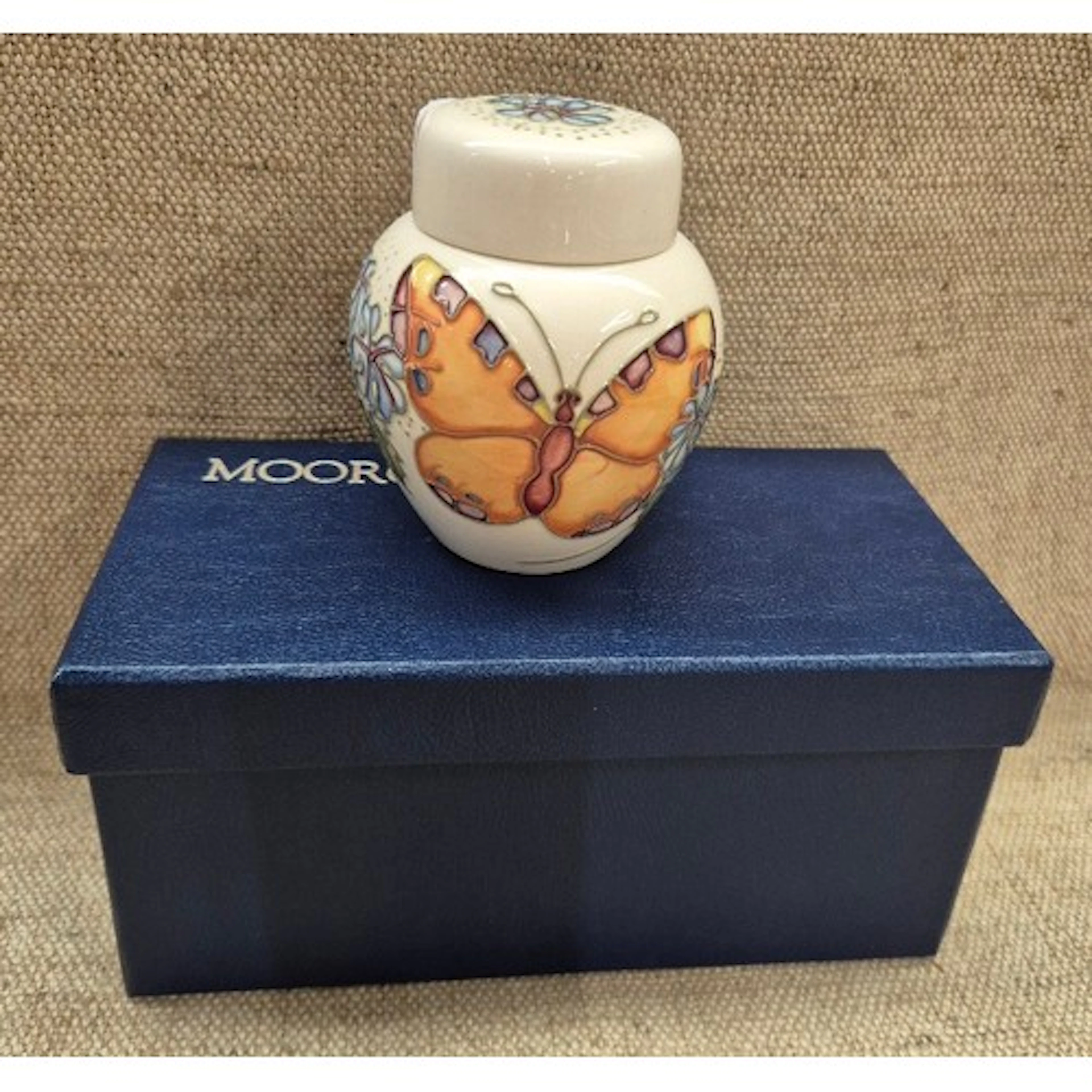 A boxed Moorcroft ginger jar with butterfly design, height w...