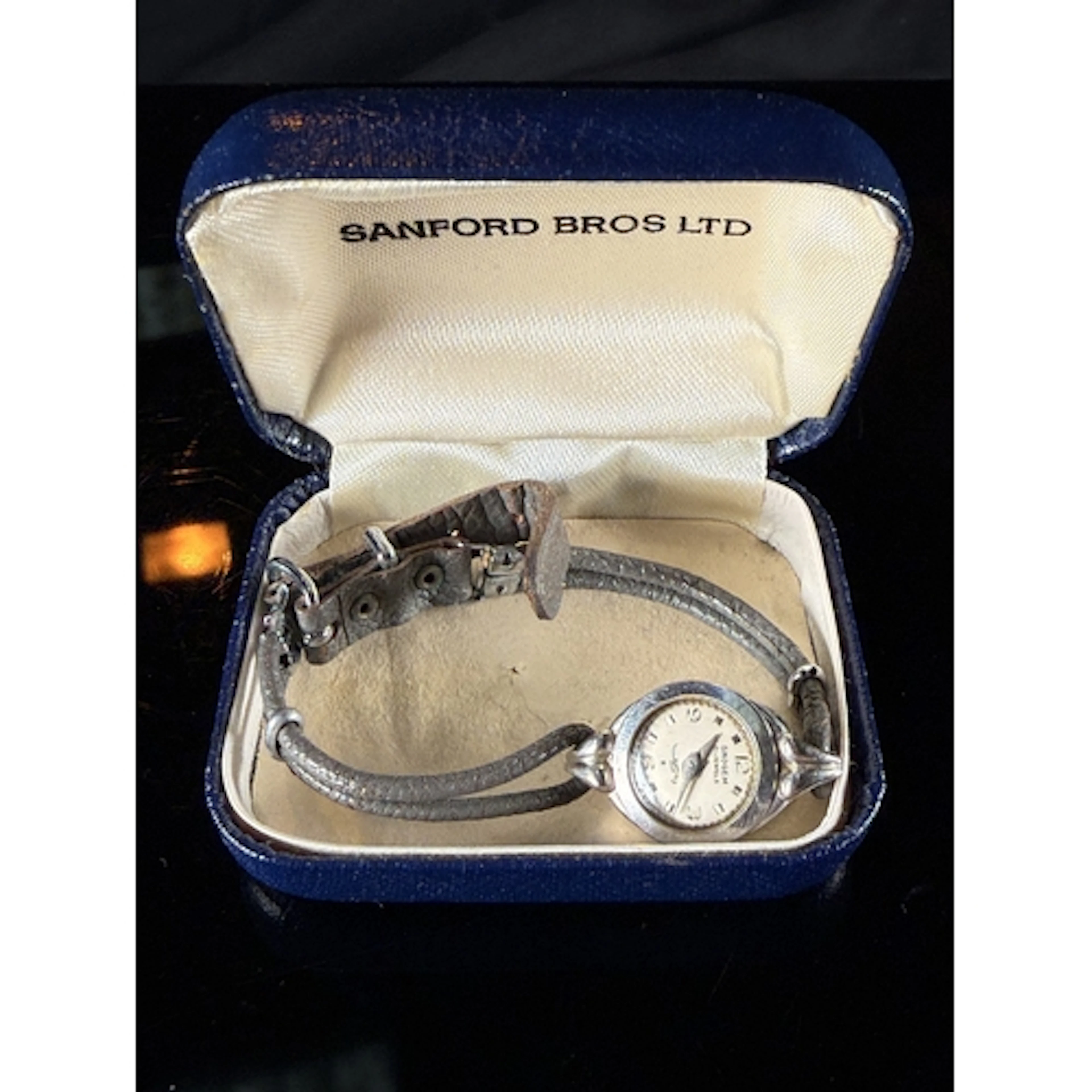 A vintage Ladies Snogem ladies white metal cased wristwatch,...