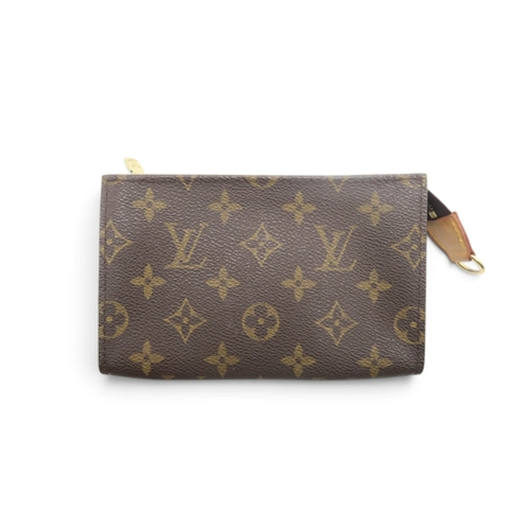 A Louis Vuitton purse in monogrammed coated canvas length ...