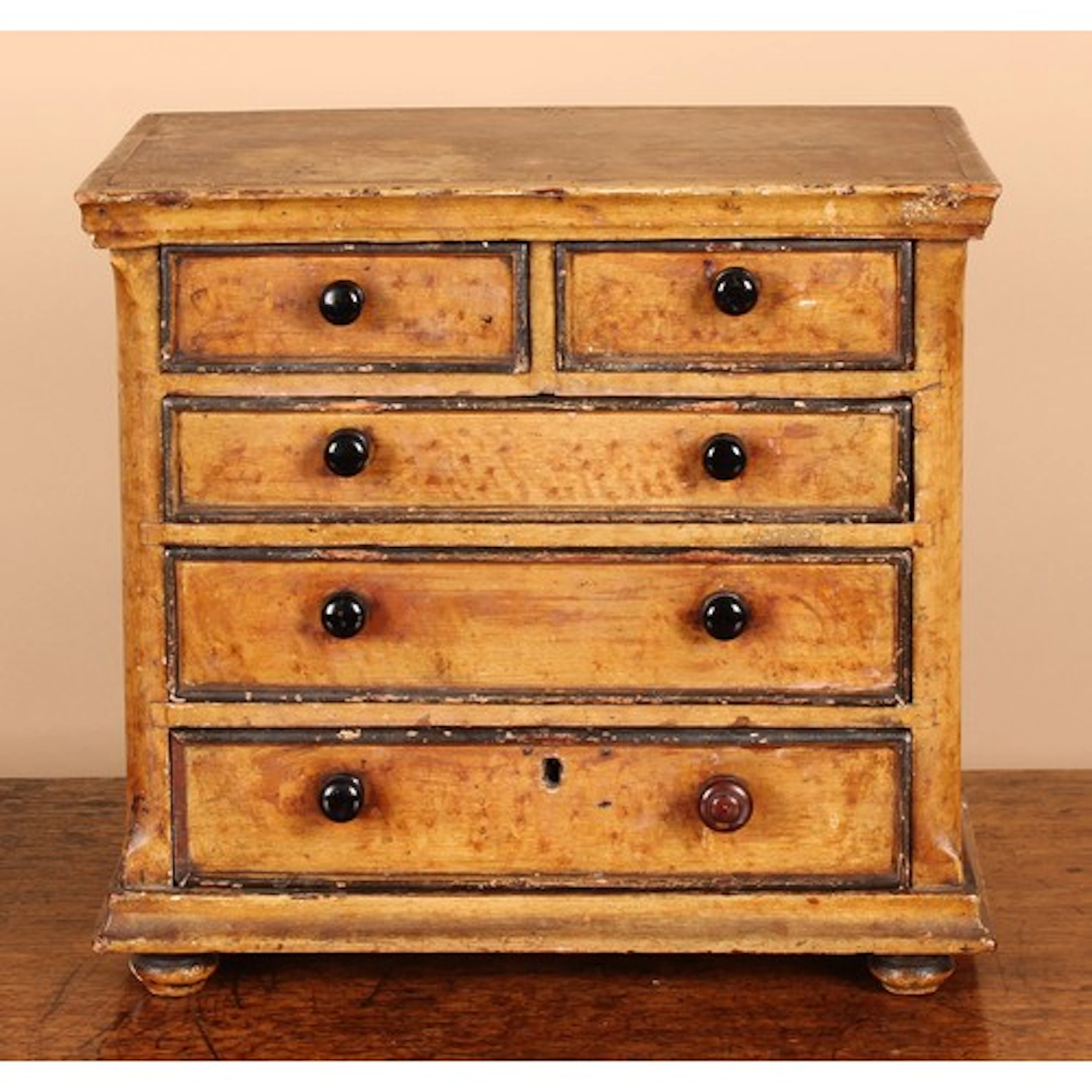 Miniature Furniture - a Victorian scumbled pine chest of two...