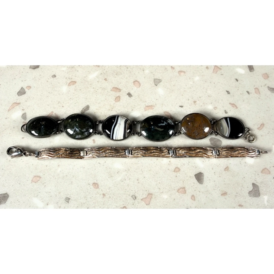 A hallmarked silver bracelet formed from elongated curved re...