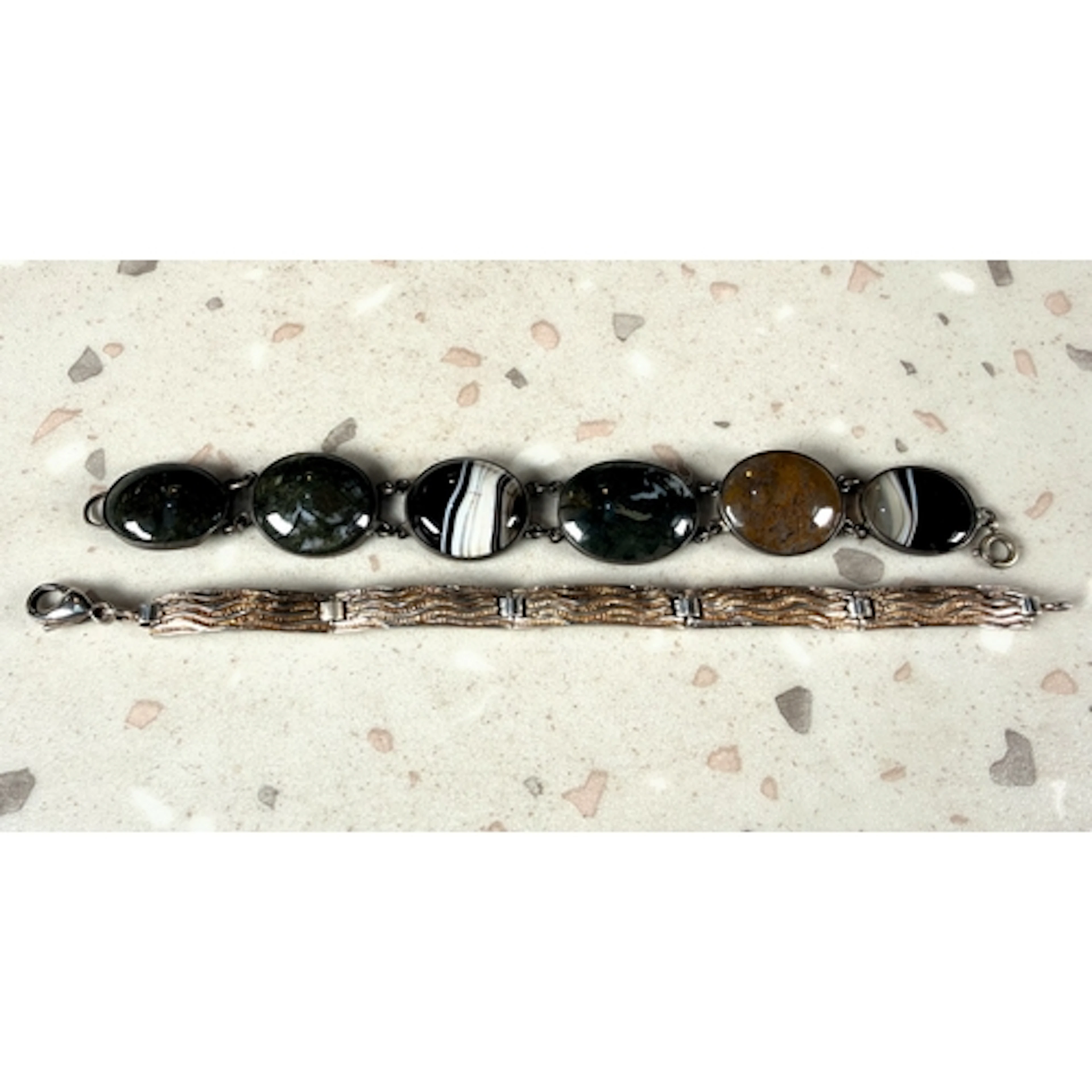 A hallmarked silver bracelet formed from elongated curved re...