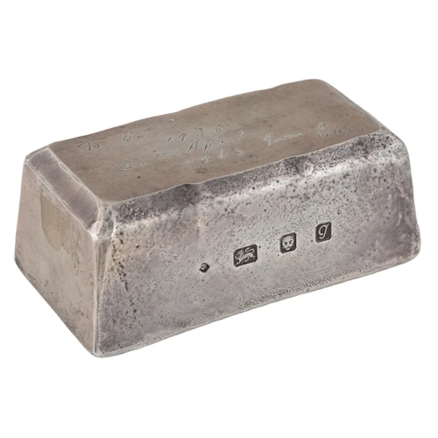 An Elizabeth II silver presentation silver ingot paperweight...
